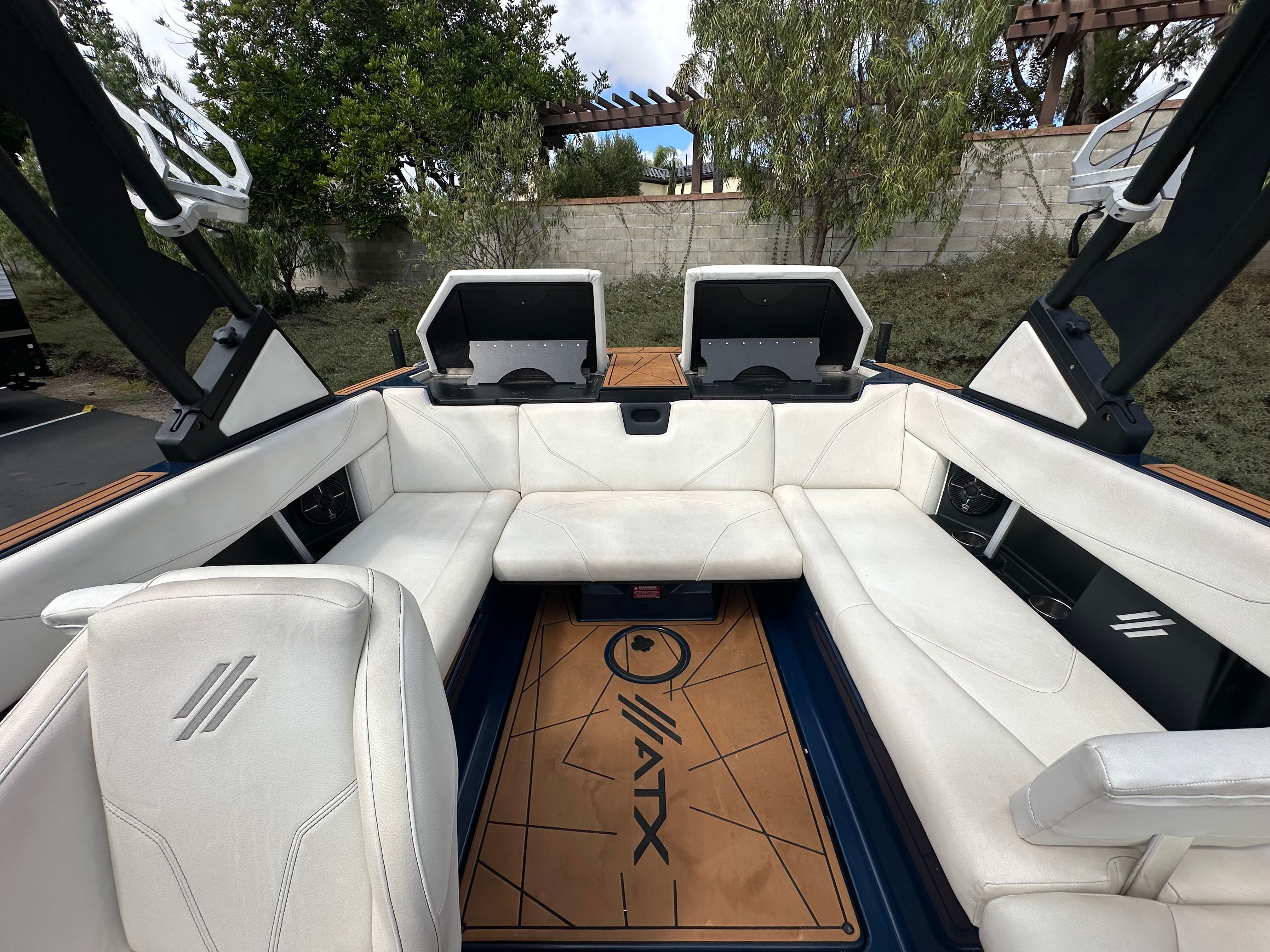 Interior of a 2021 ATX Surf Boats 22 Type-S with white seating.