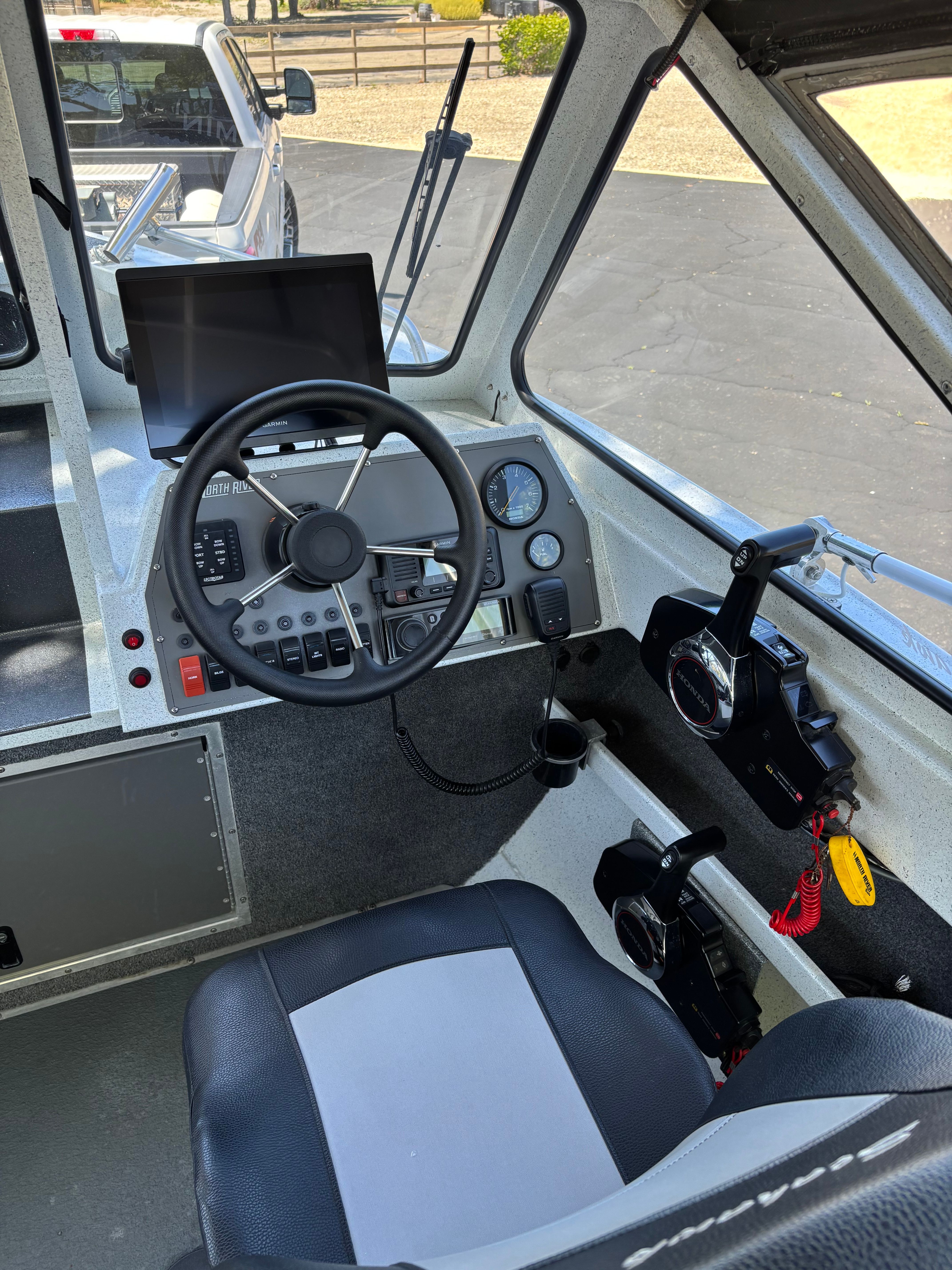 Interior of a 2020 Sea Hawk North River boat with steering console.