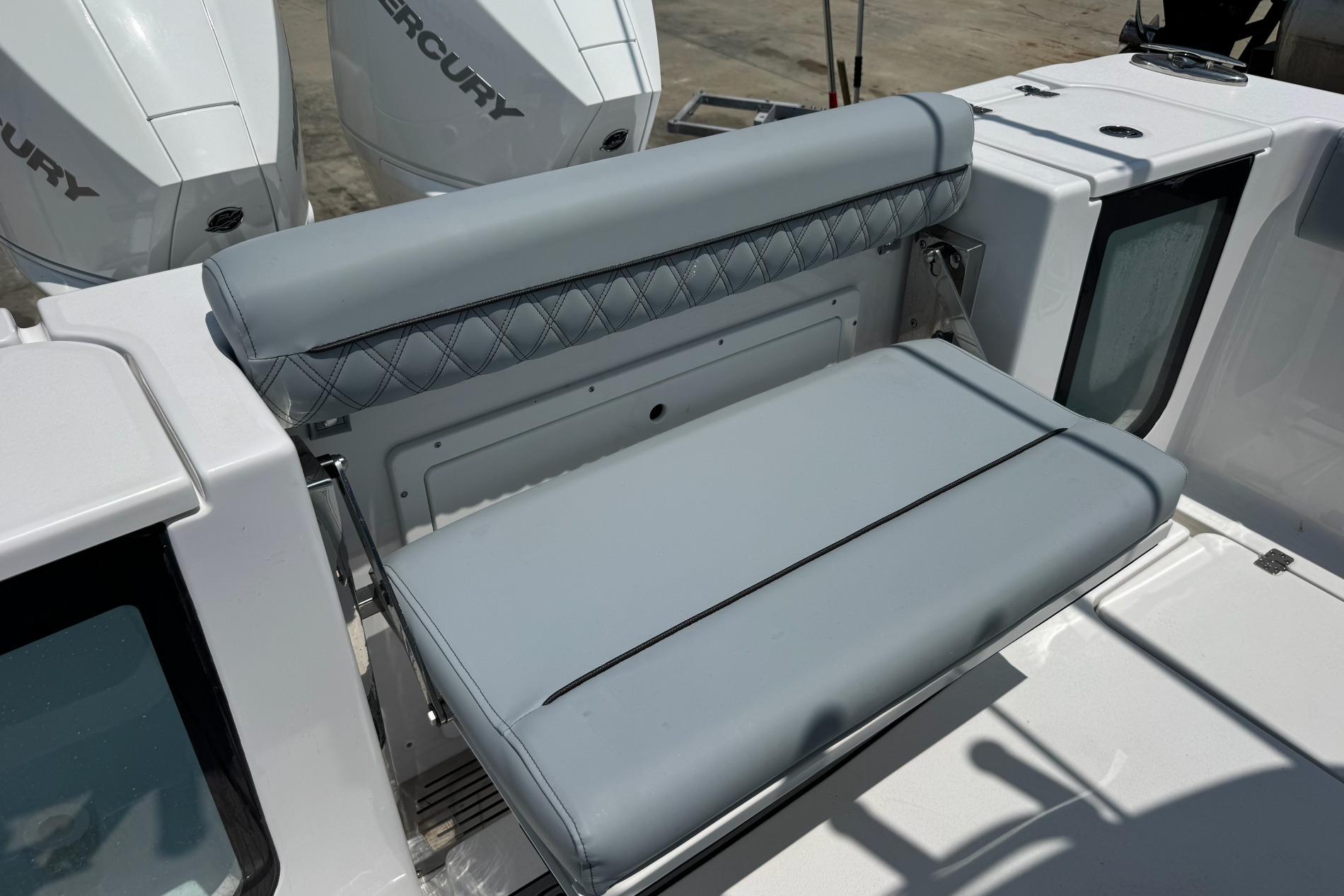 2026 Sportsman Open 262 Center Console boat with cushioned seating and dual Mercury engines.
