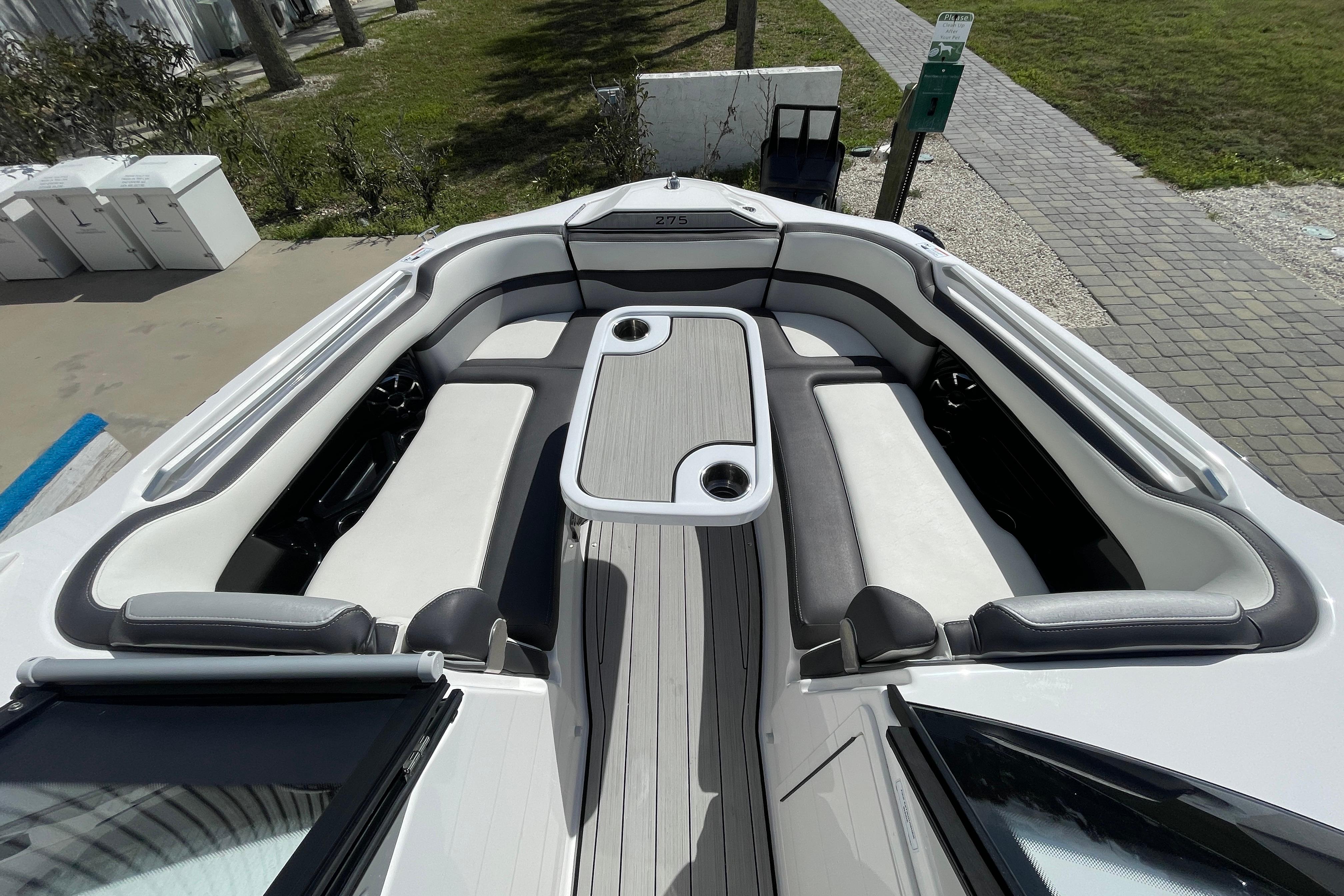 2021 Yamaha Boats 275SE interior with spacious seating and table setup.