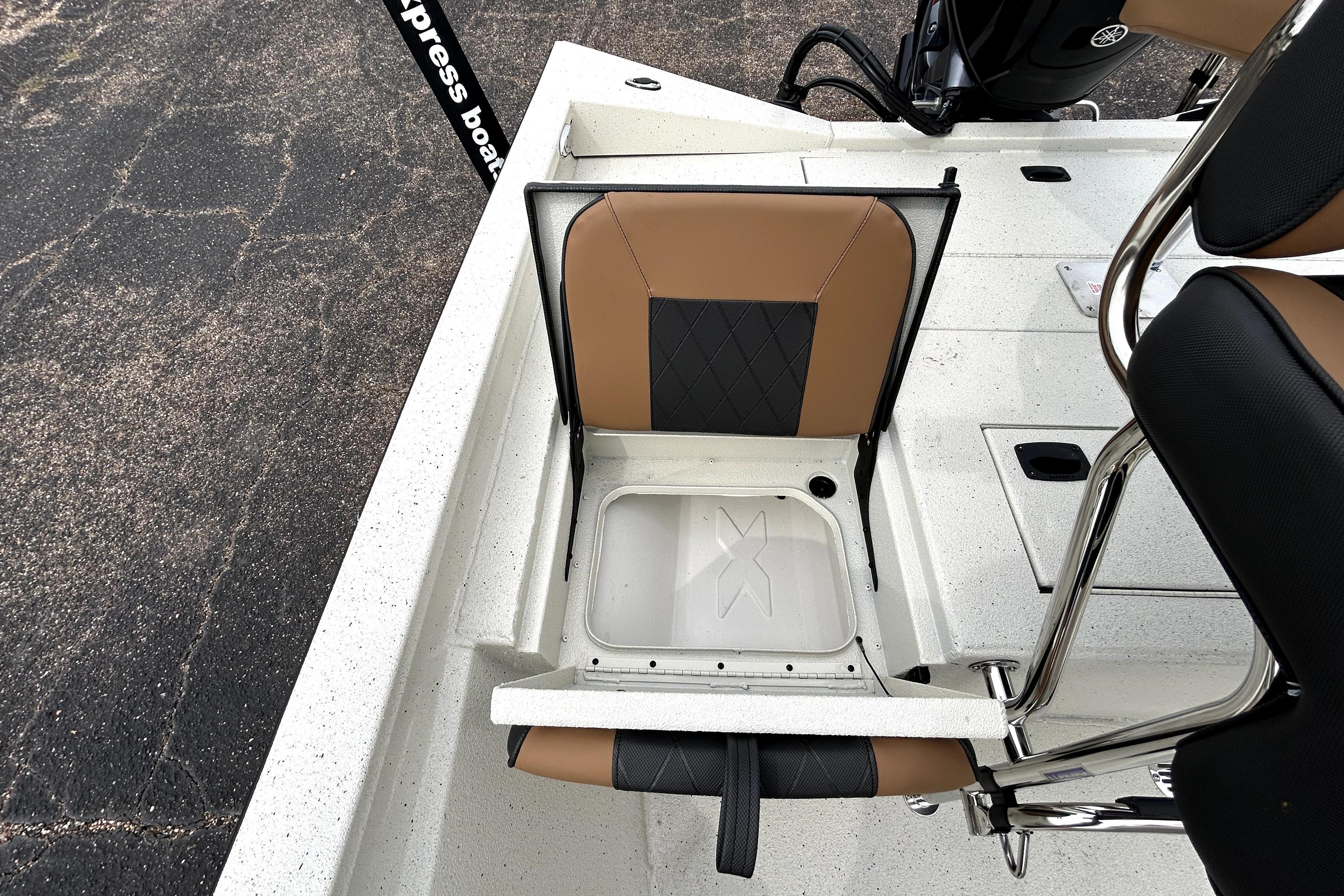 2026 Xpress H20B Bay boat with foldable seat and storage compartment.