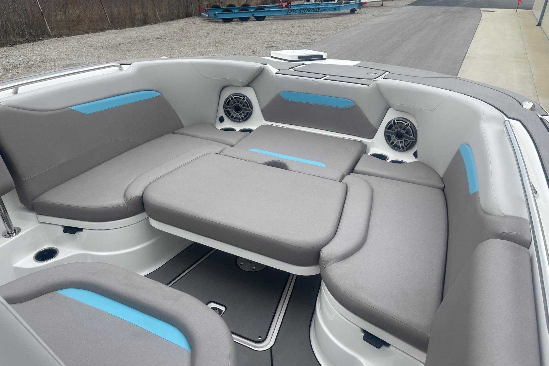 2025 Hurricane Center Console 24 OB boat interior with gray seating and blue accents.