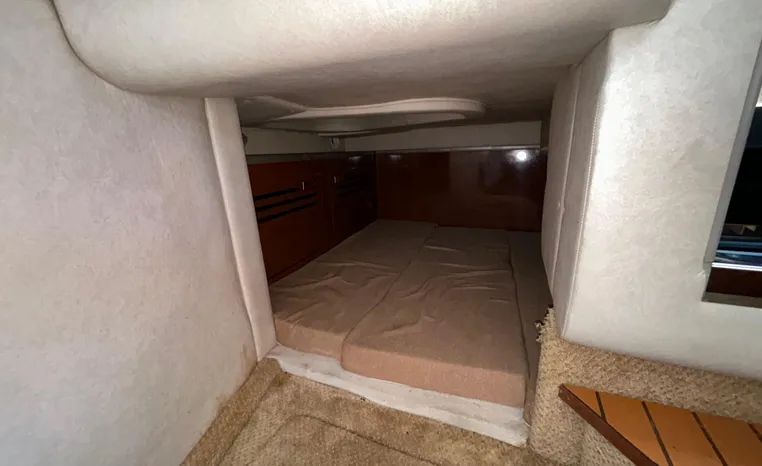 Interior of 2010 Sea Ray Sundancer 260 with sleeping area.
