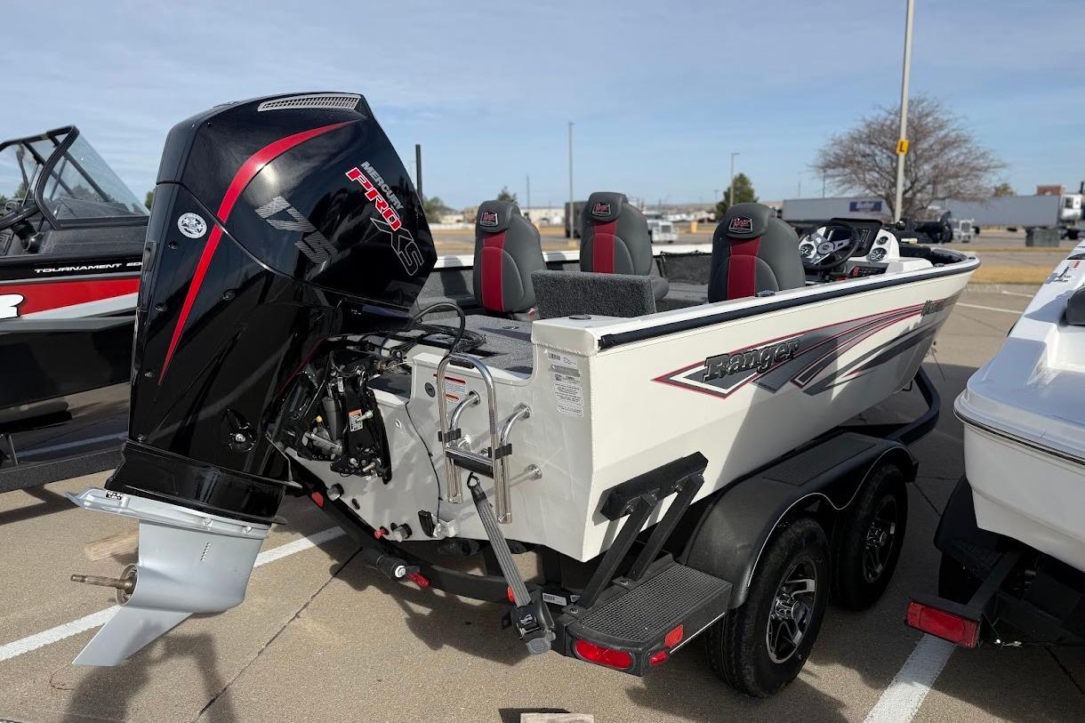 2026 Ranger VS1882SC Reata boat with powerful outboard motor in a parking lot.