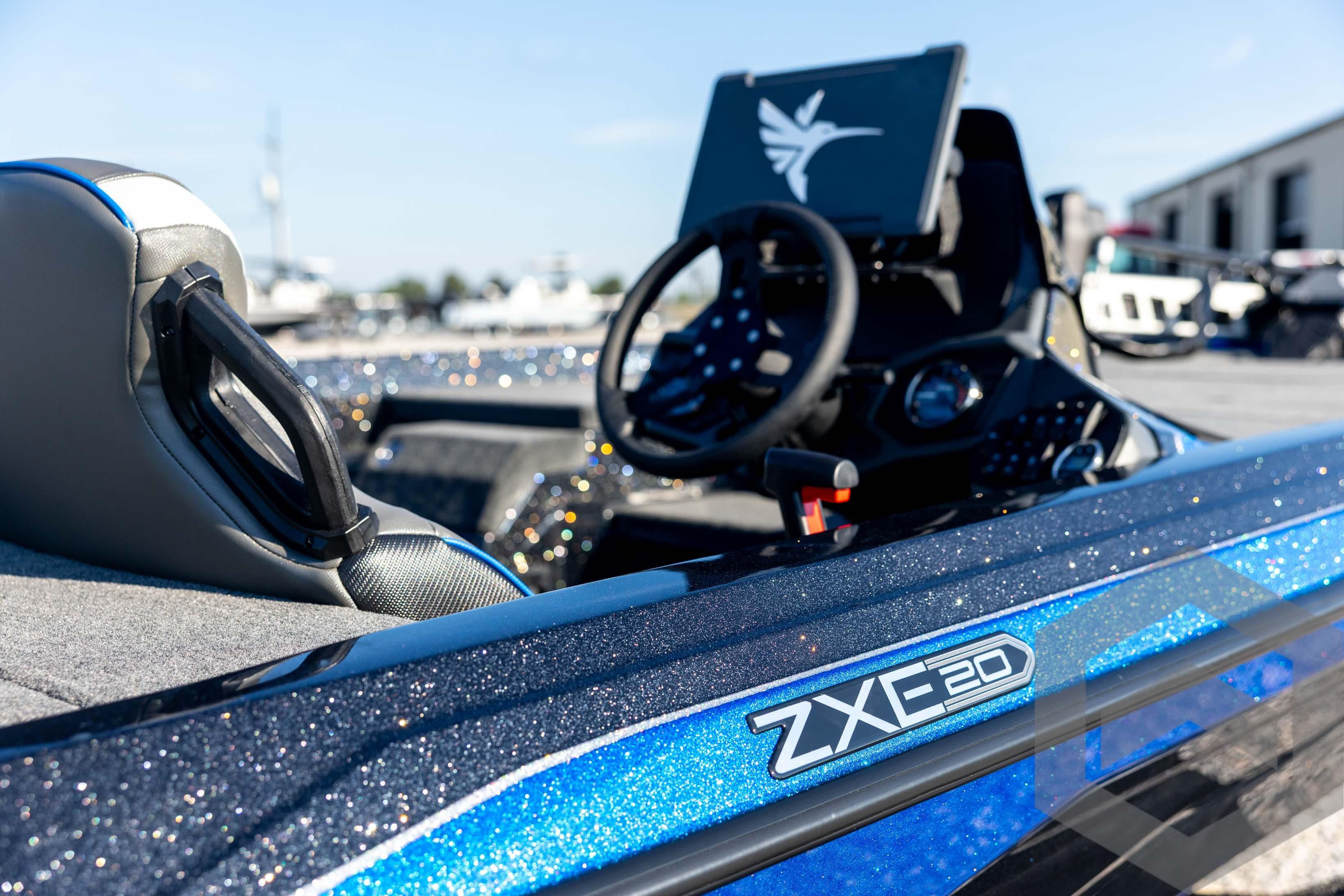 2026 Skeeter ZXE20 boat interior with steering wheel and sparkling blue finish.