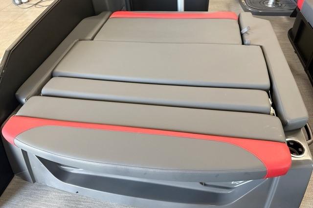 2027 Godfrey Monaco 25' Tritoon lounge seat, gray and red upholstery, mid-table flip design.