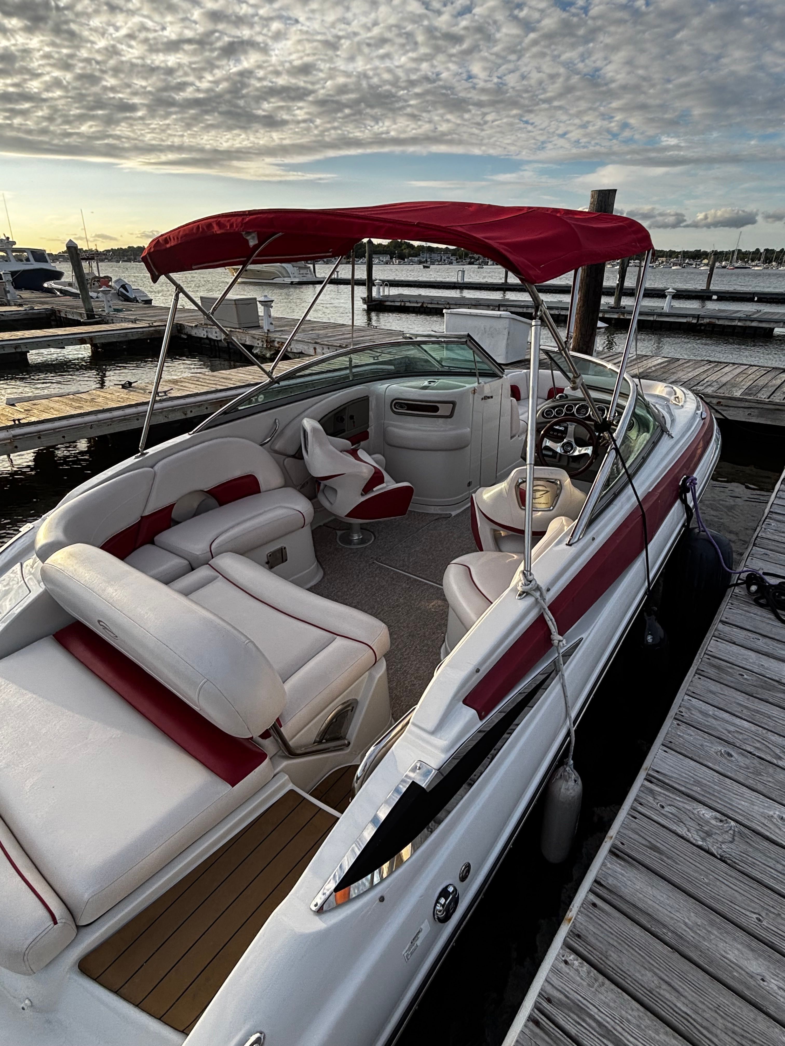 2014 Crownline Eclipse E2 boat docked at sunset.