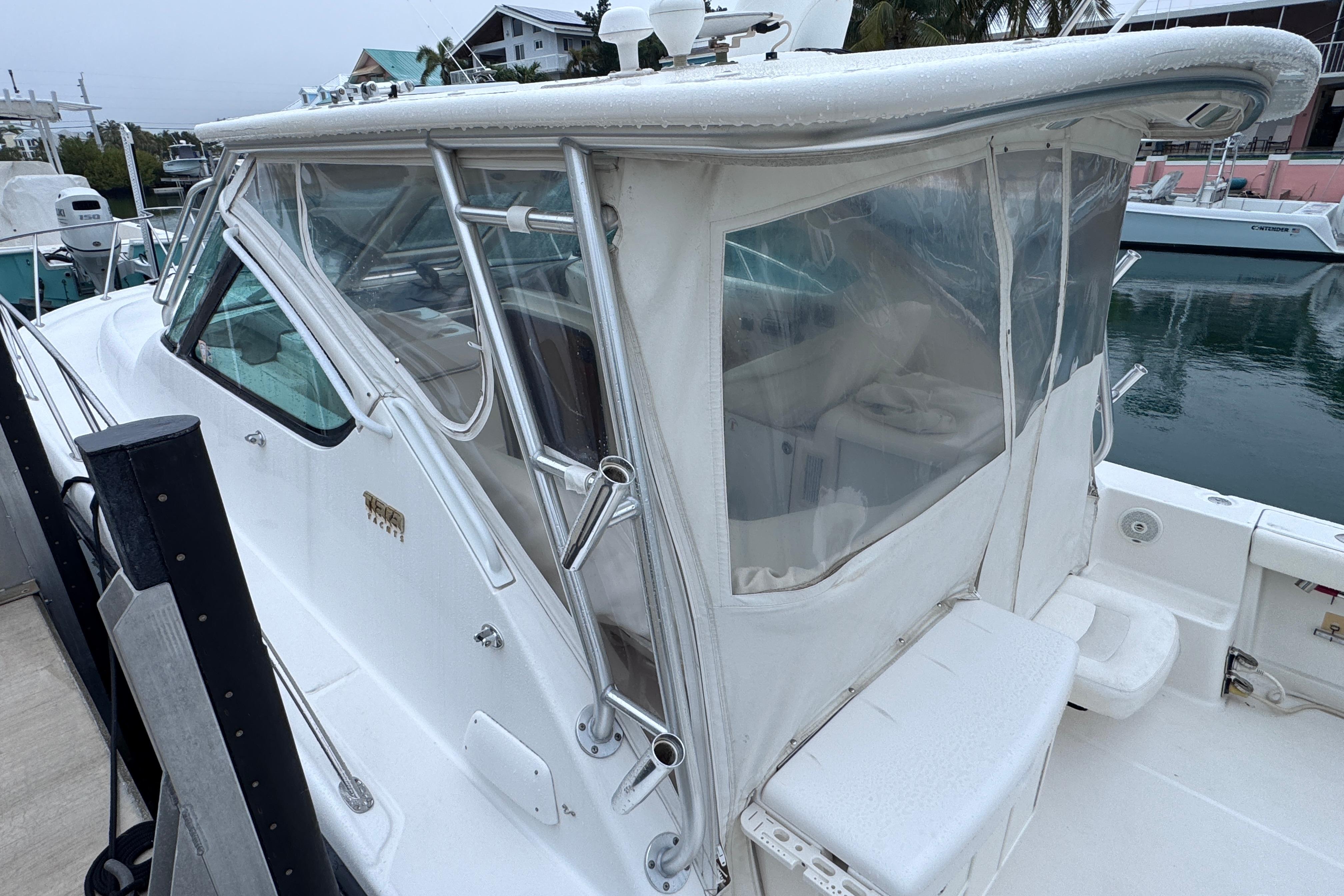2006 Tiara Yachts 3600 Open with enclosed cockpit, docked at marina.