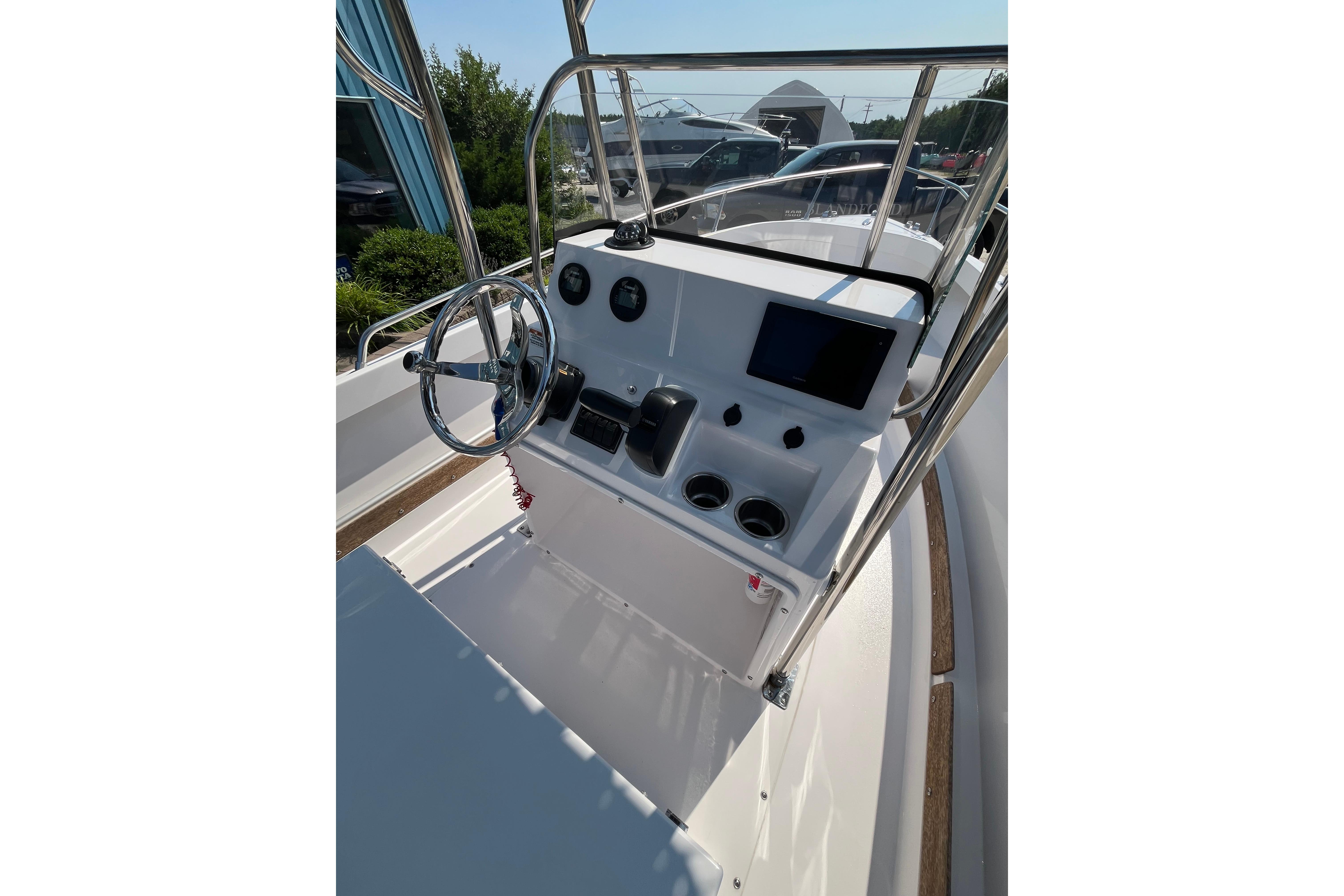 2021 Rossiter 17 CC boat console with steering wheel and gauges.