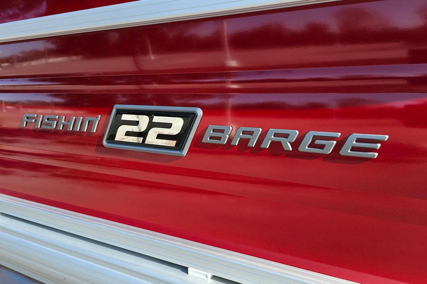 2026 Sun Tracker Fishin' Barge 22 DLX logo on red background.