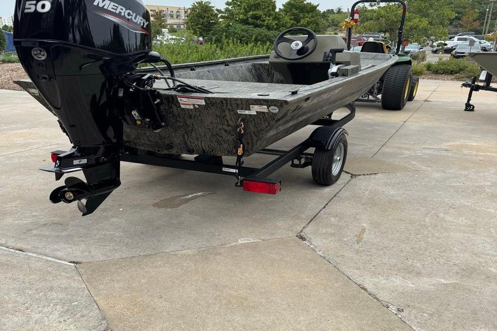 2026 Tracker Grizzly 1648 SC boat with Mercury 50 engine on trailer.