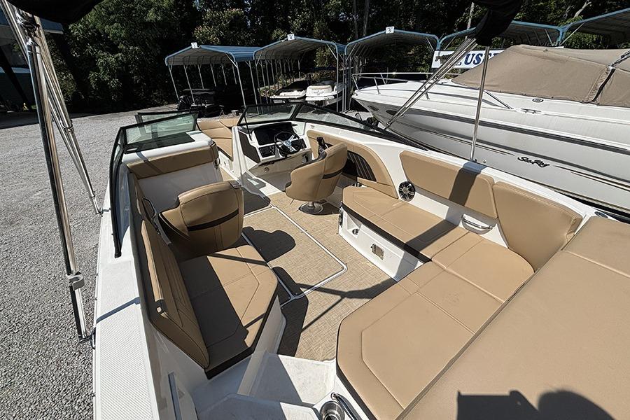 2019 Sea Ray SPX 230 Outboard boat interior with tan seating and modern design.
