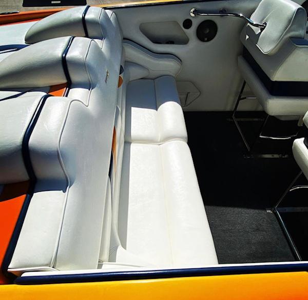Interior of a 2001 Eliminator Eagle boat with white leather seats.