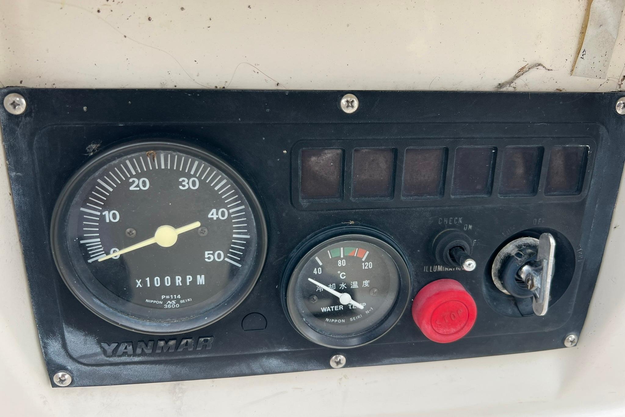 Control panel of a 1998 Sabre 362 with Yanmar RPM and temperature gauges.
