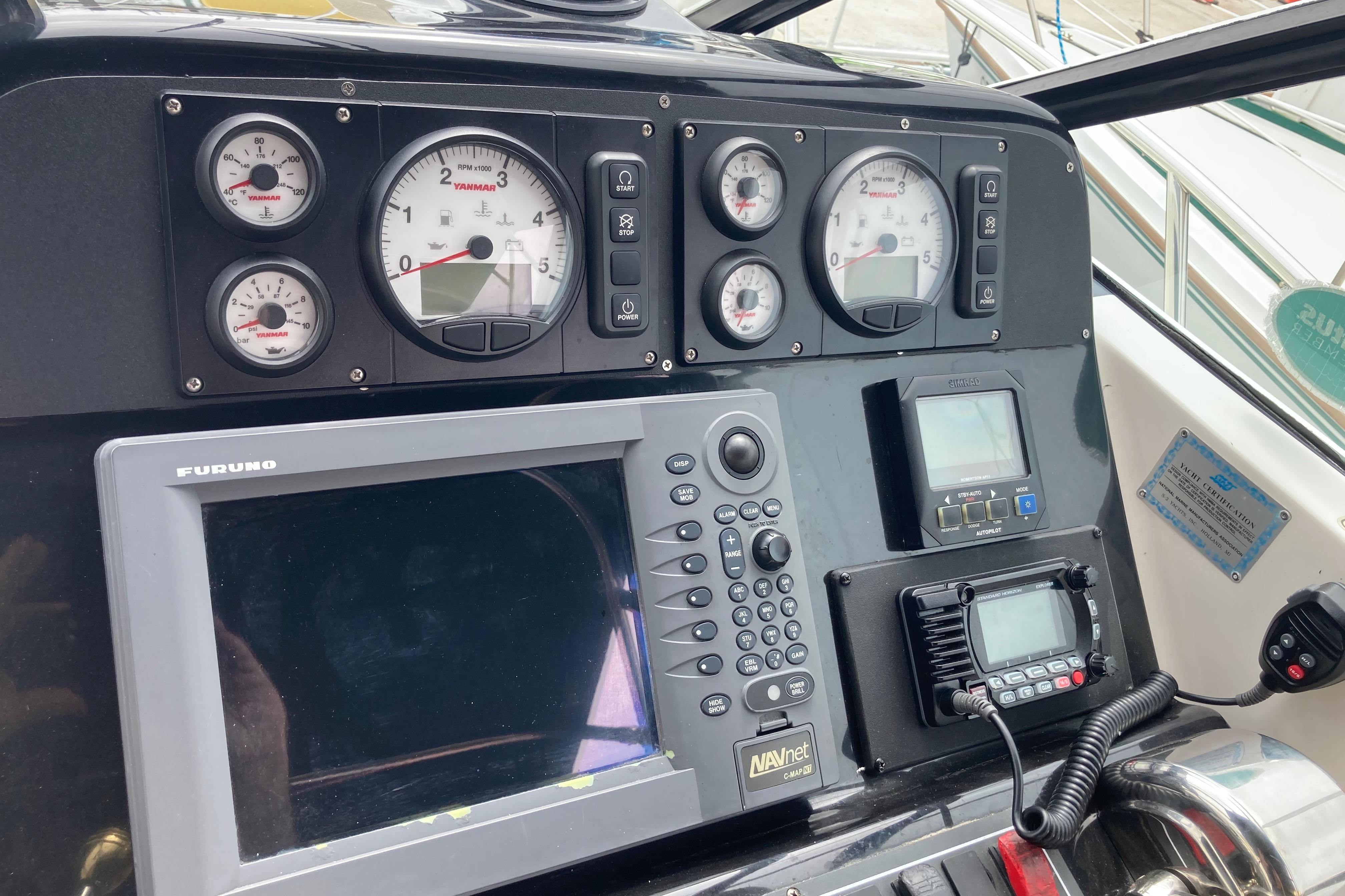 Dashboard of a 2002 Tiara Yachts 2900 Open with navigation and control instruments.