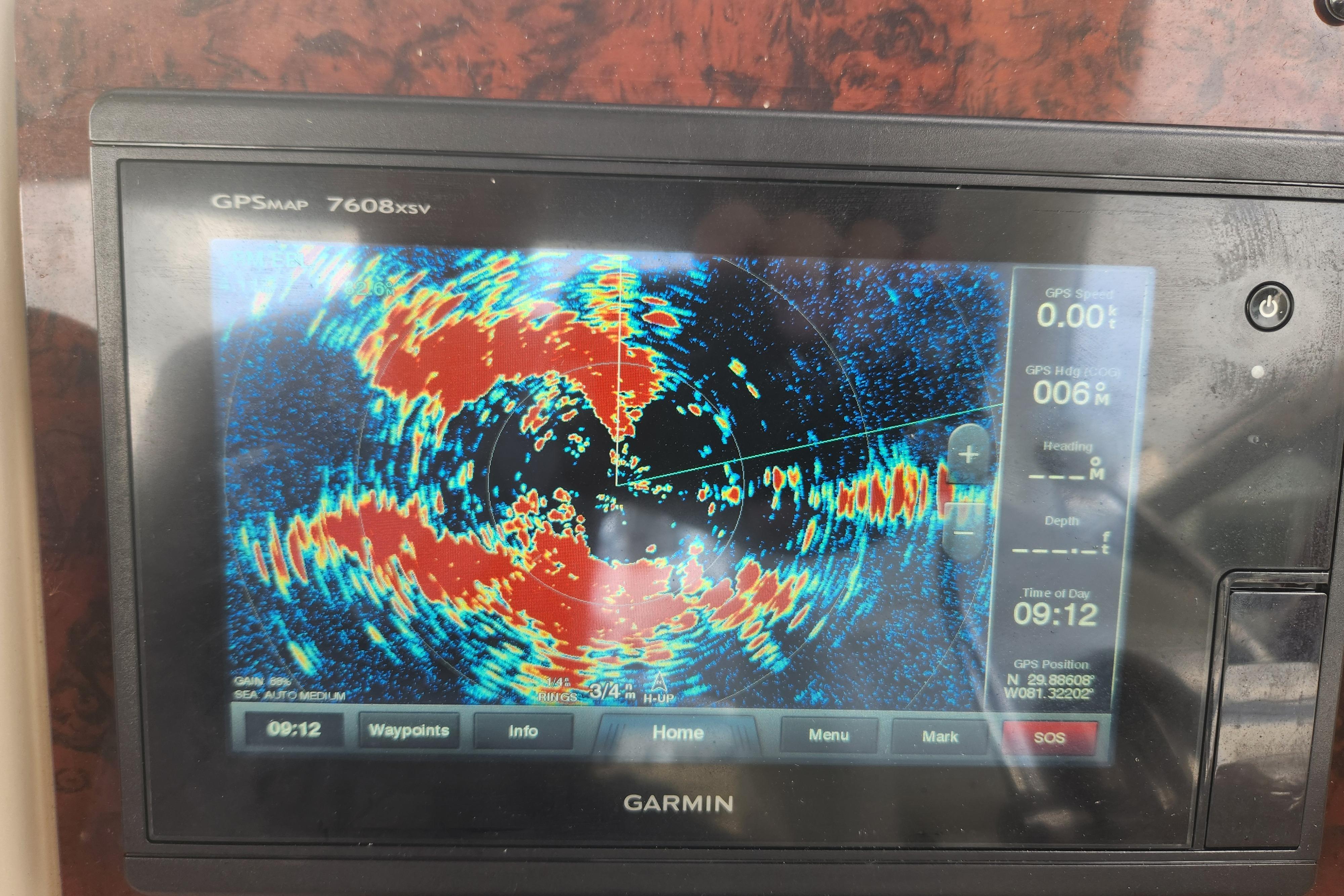 Garmin GPS display on 2003 Sea Ray 360 Sundancer, showing radar and navigation data.