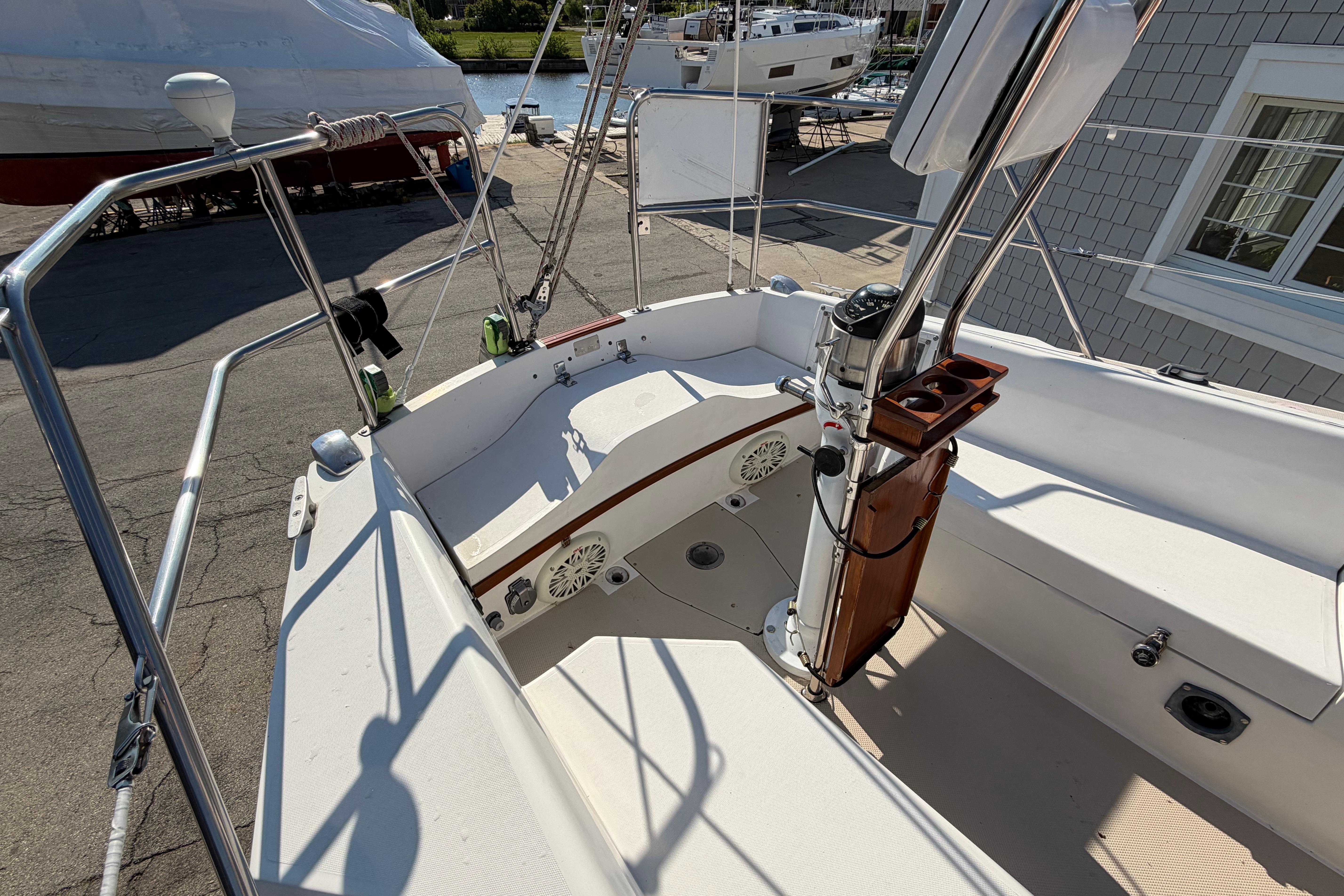 Cockpit of a 1988 Catalina 30 MkII sailboat, featuring steering and seating area.