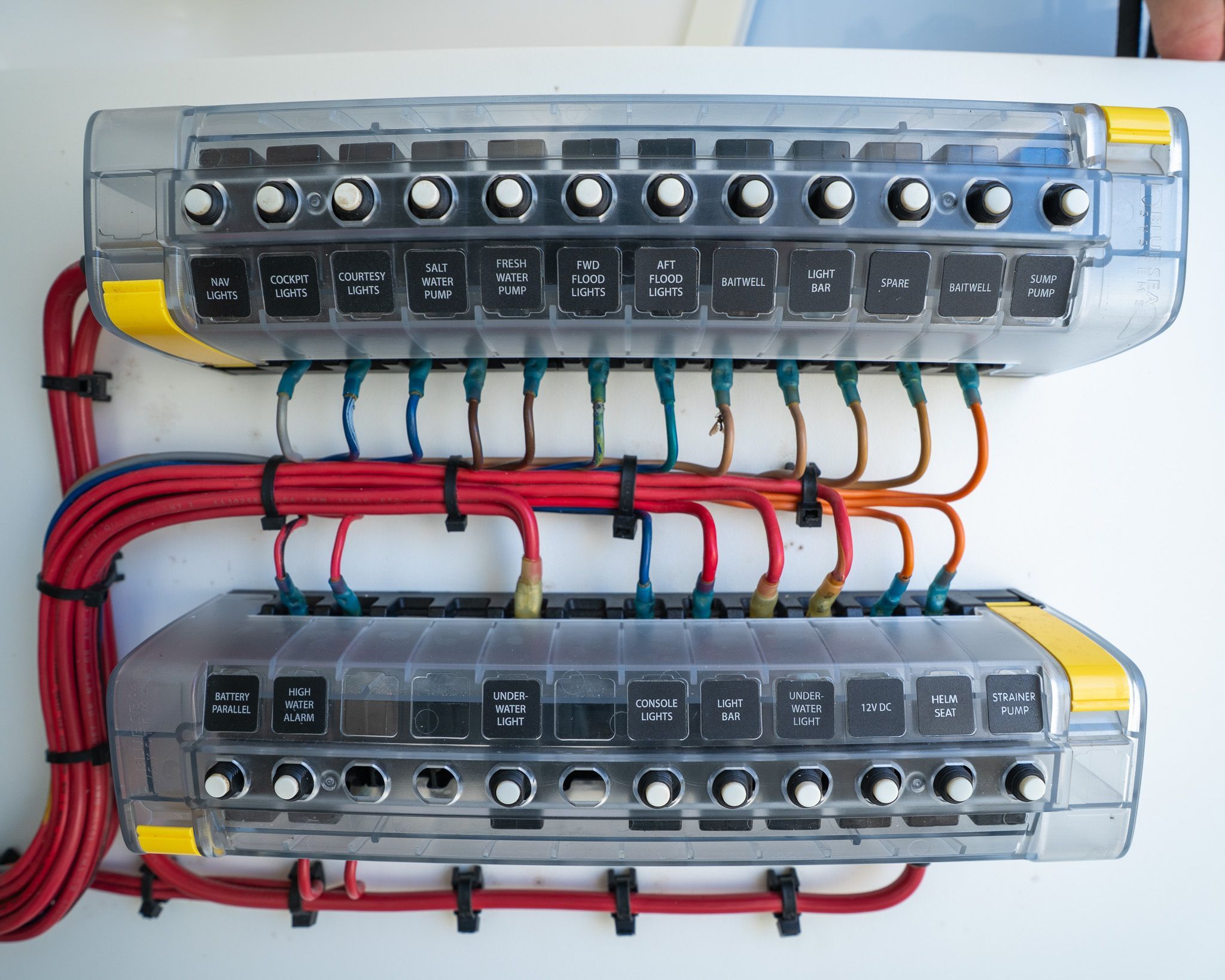 Electrical switch panel on a SeaVee 370Z boat, showing various switches and wiring.