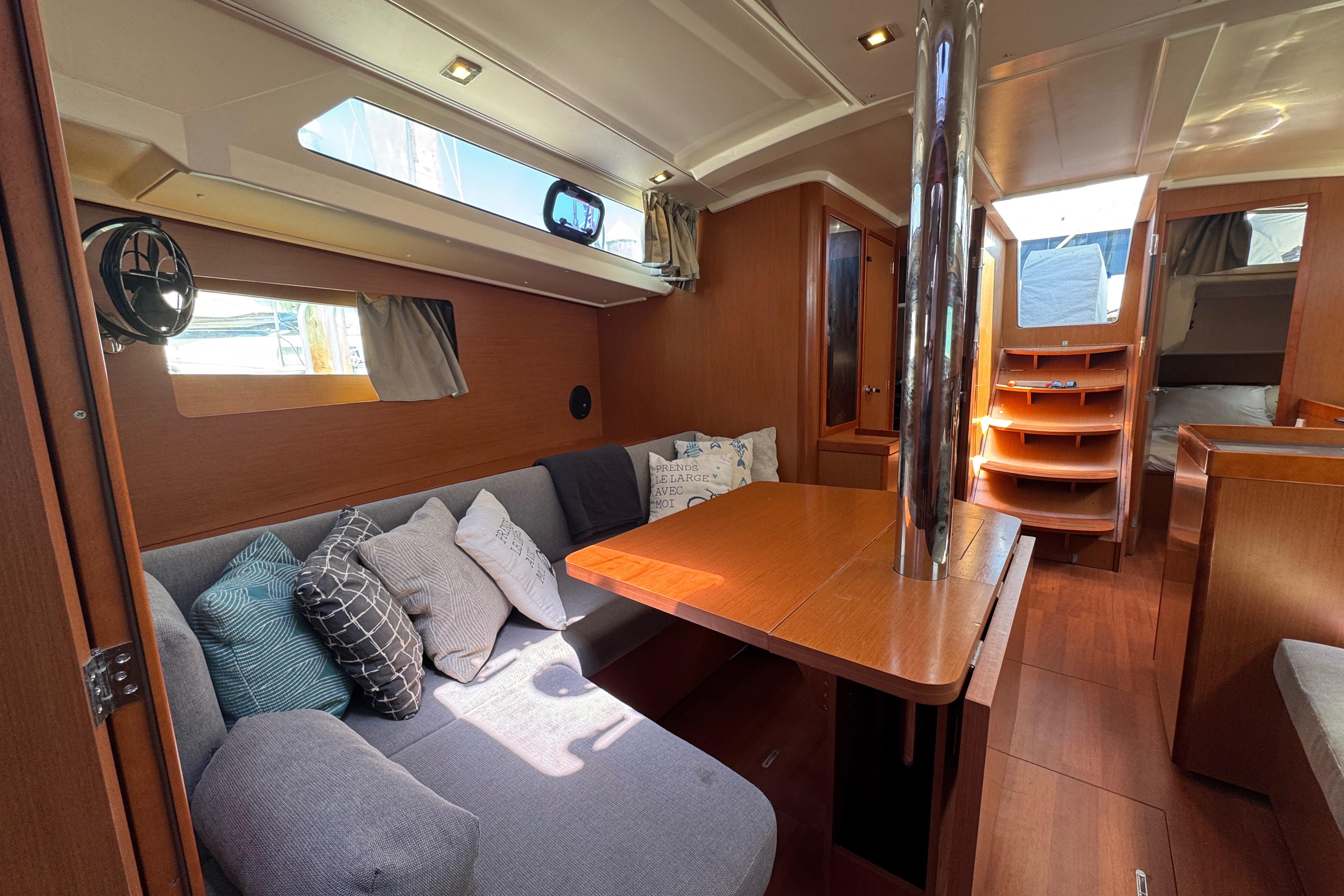 Interior of 2017 Beneteau Oceanis 41.1 yacht with cozy seating and wooden finishes.