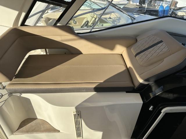 2017 Sea Ray Sundancer 350 Coupe interior with beige seating and modern design.