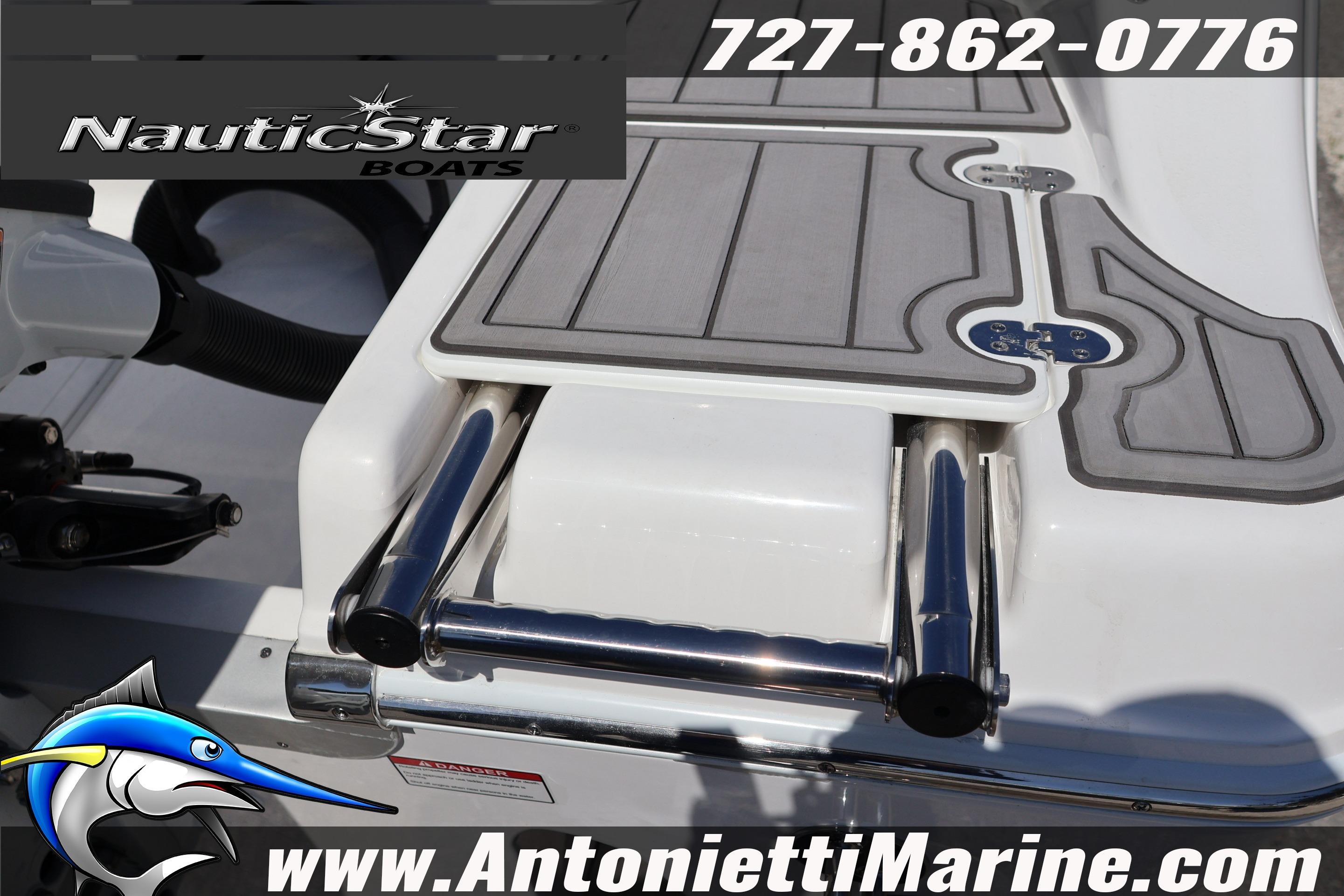 2026 NauticStar 292 Legacy boat with swim platform and ladder, featuring marine branding.