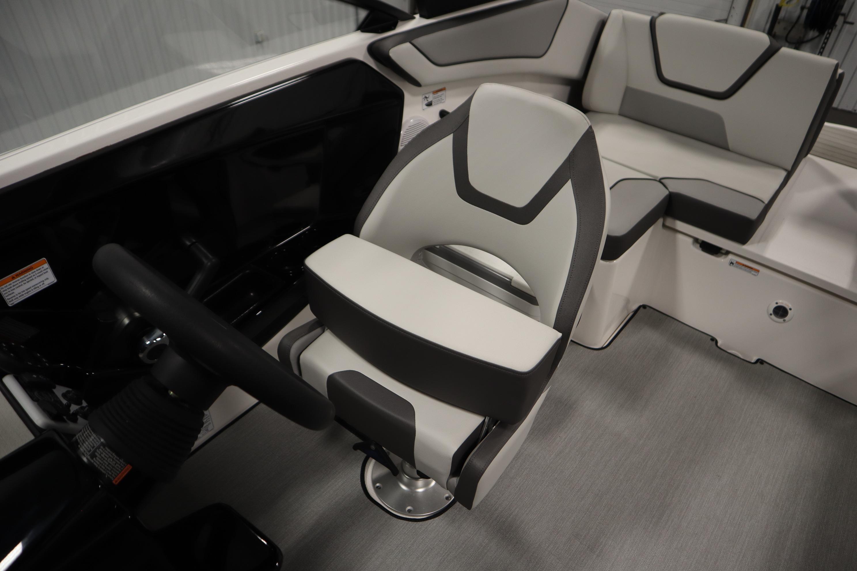 2026 Yamaha Boats AR220 interior with modern seating and steering wheel.