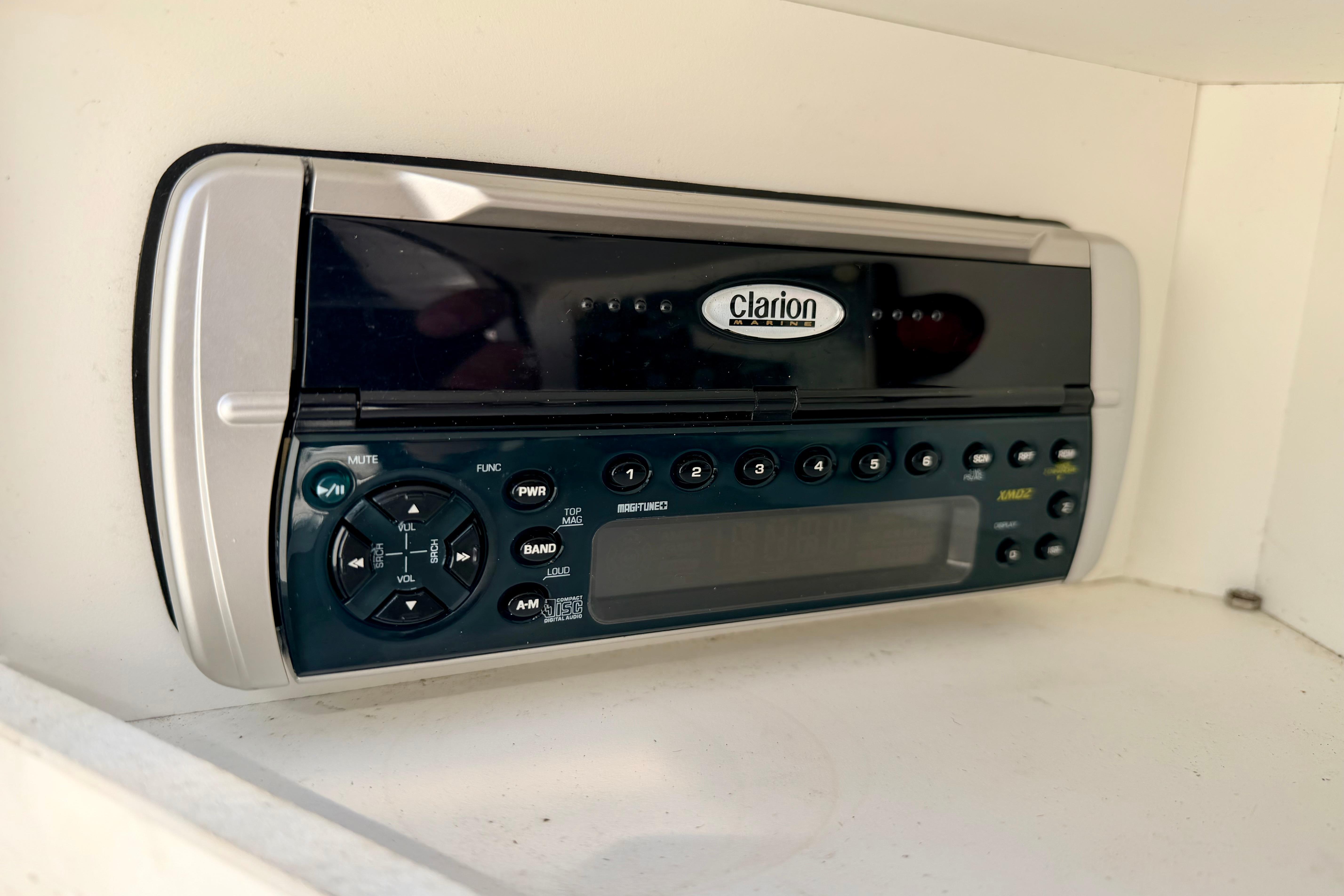 Clarion stereo system in a 2003 Sea Ray 200 Sundeck boat interior.