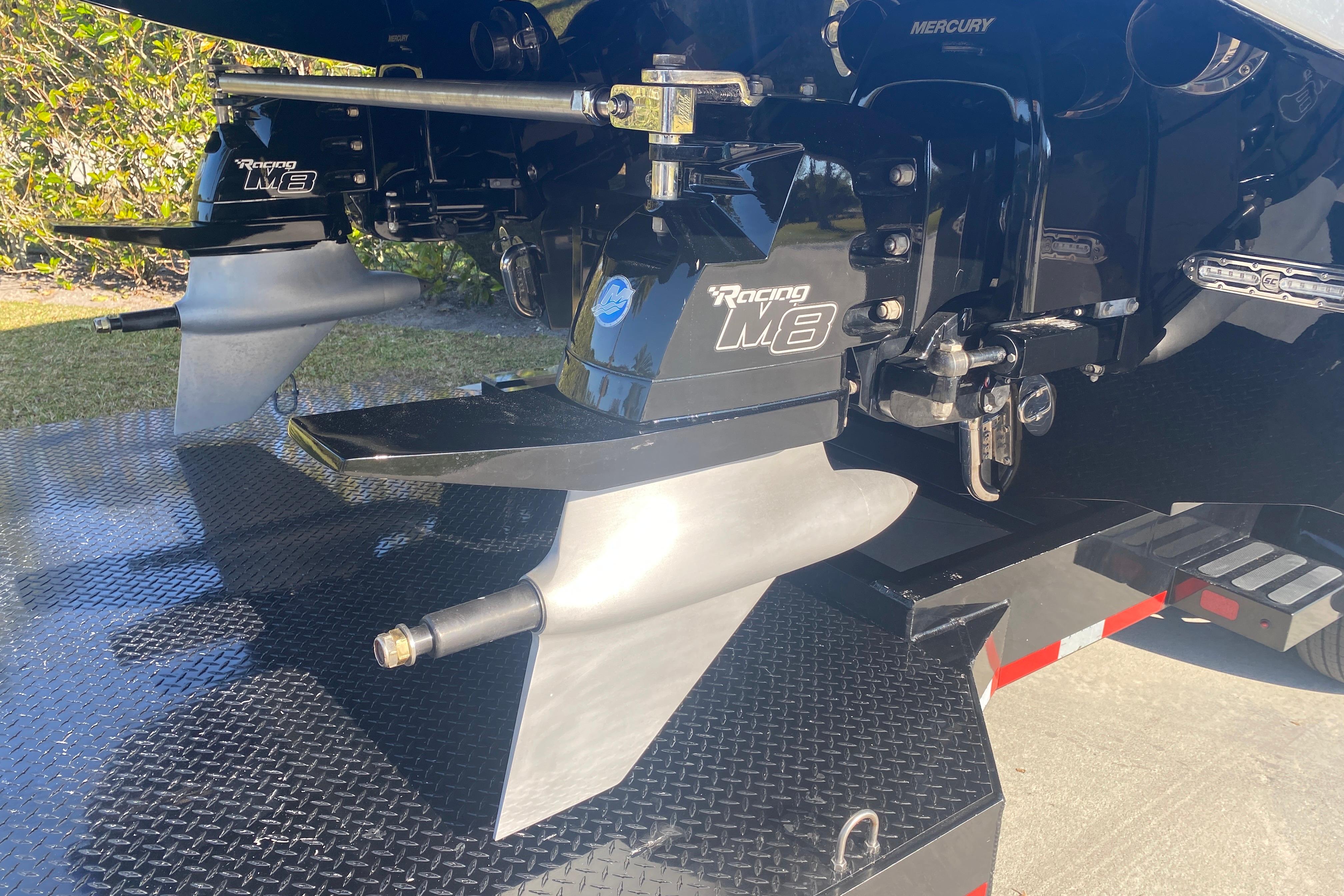 Outboard motors on a 2016 MTI 44 RP boat, featuring Mercury Racing M8 drives.