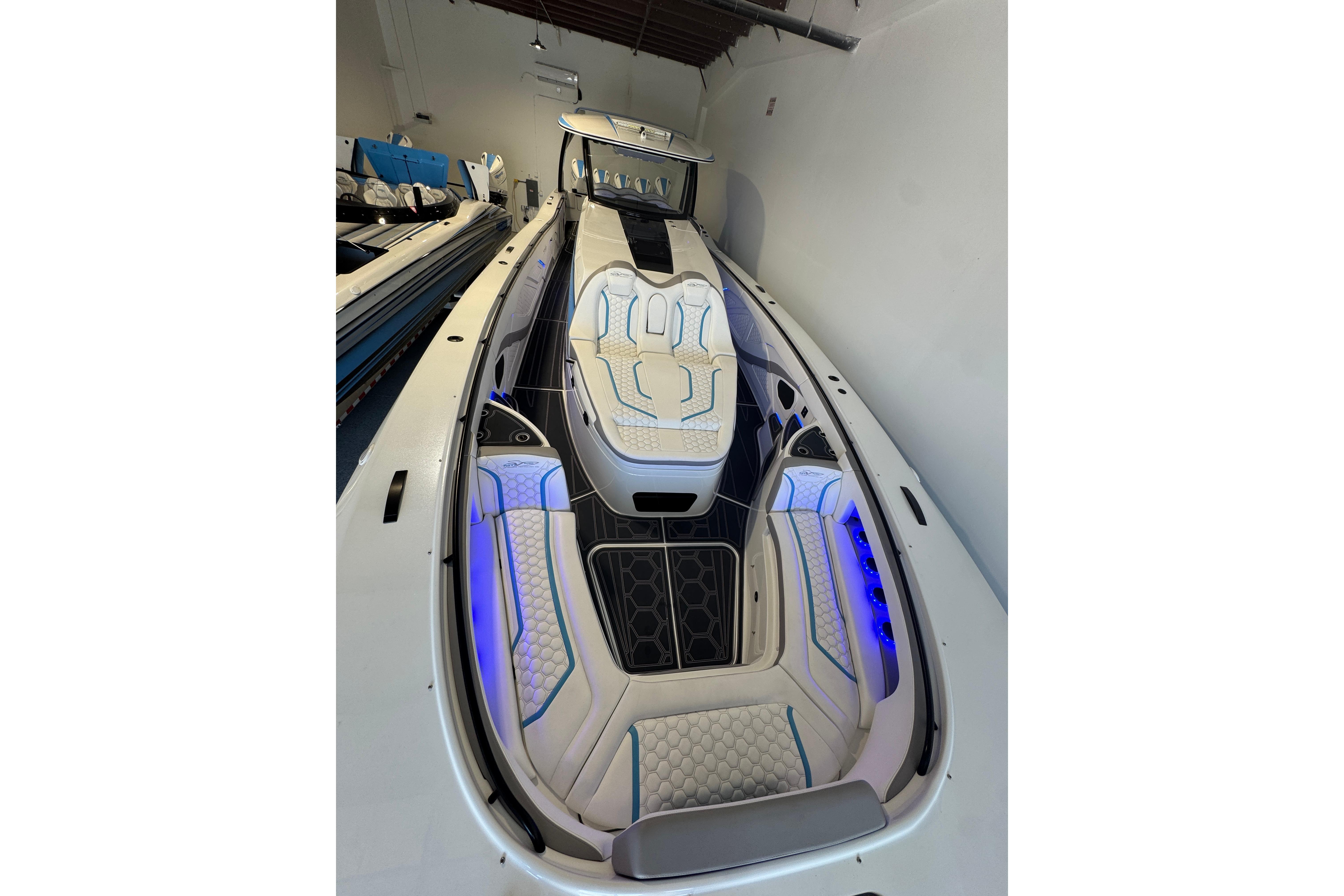 2024 MTI V50 luxury boat interior with illuminated seating and modern design.