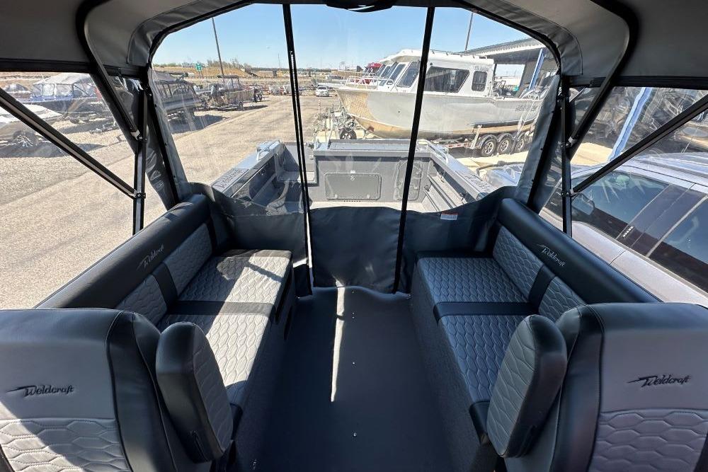 Interior view of 2026 Weldcraft 240 Maverick DV boat with spacious seating and modern design.