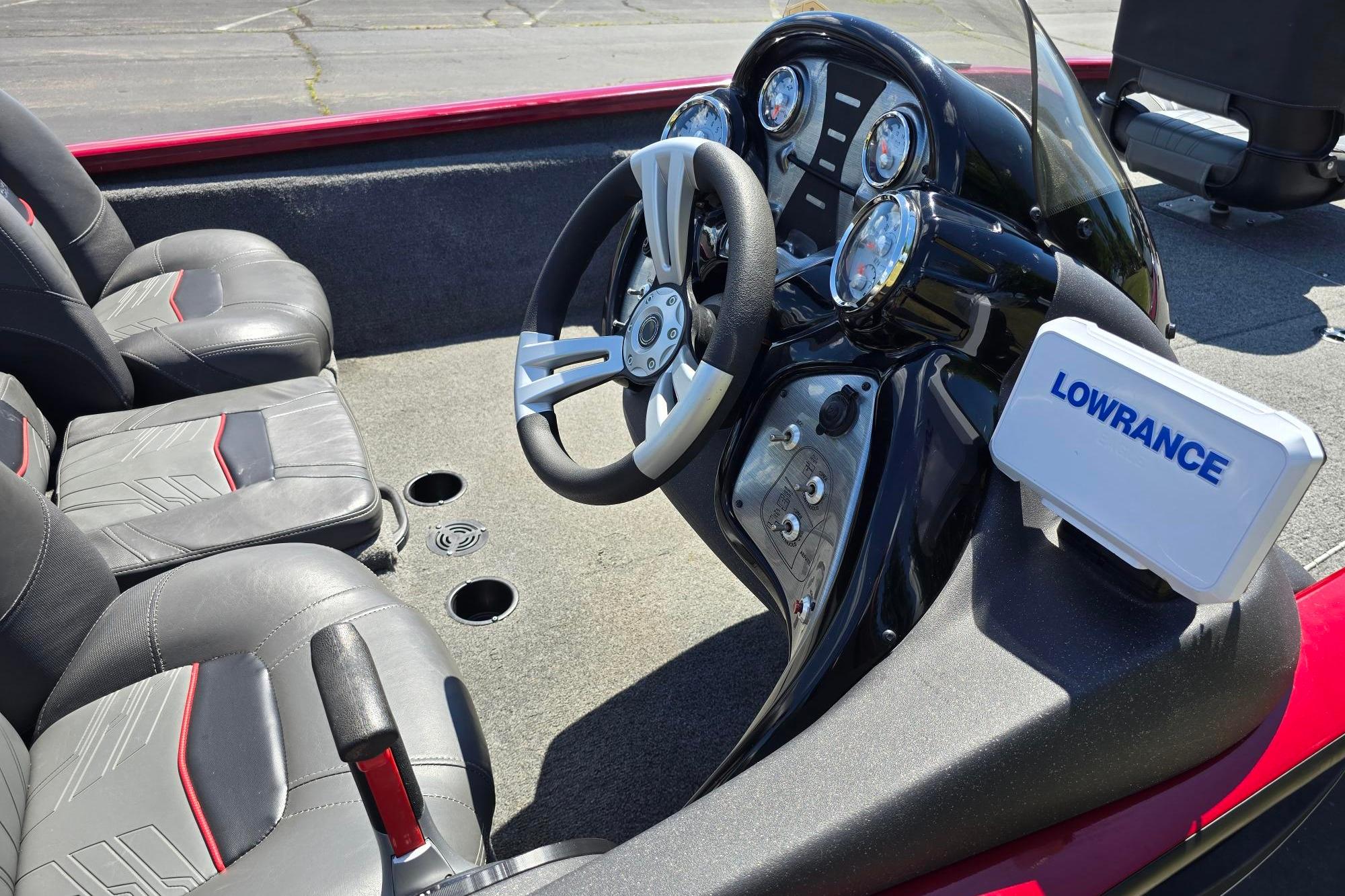 2021 Tracker Pro Team 175 TXW boat interior with steering wheel and Lowrance fish finder.