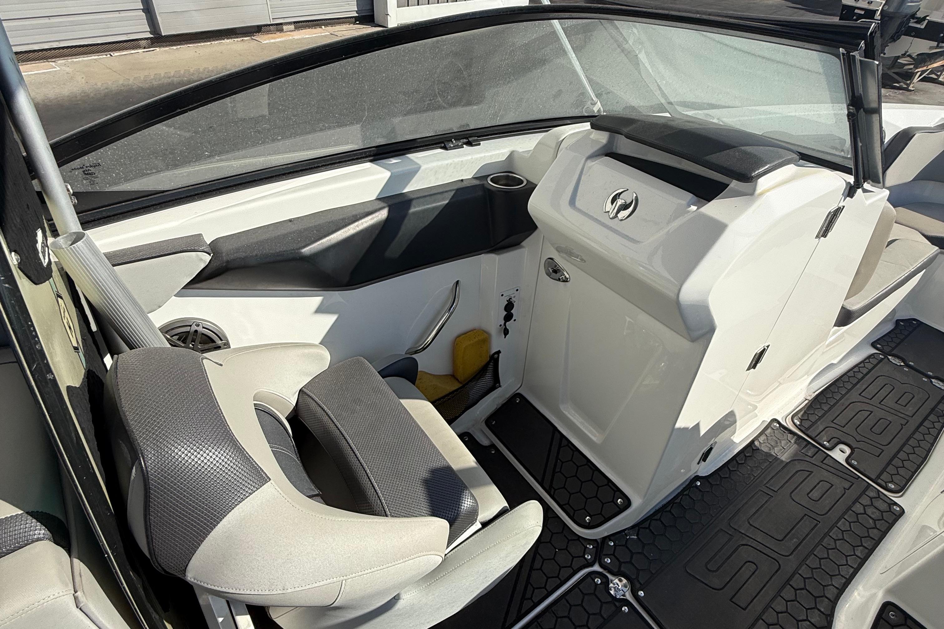 2021 Scarab 255 ID boat interior with seating and dashboard details.
