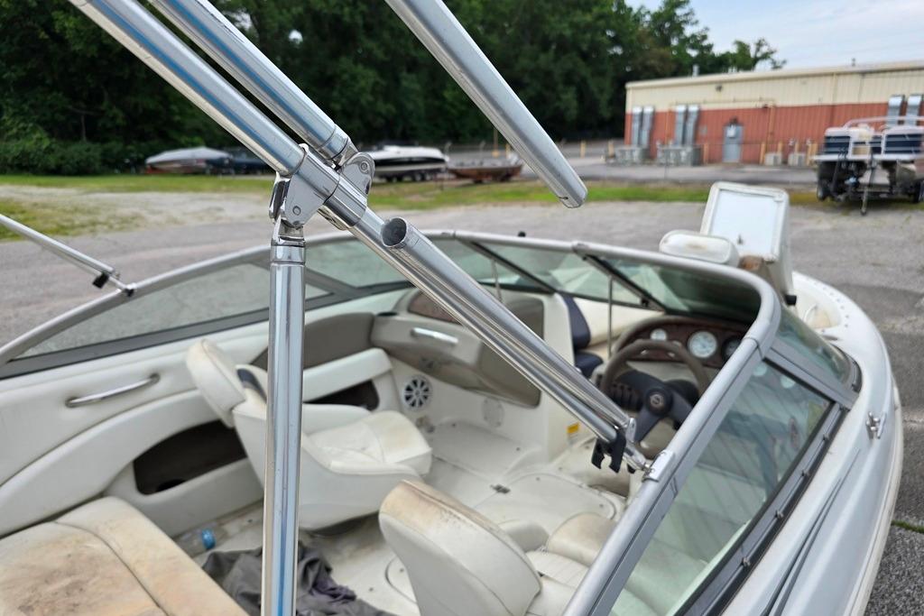 2003 Caravelle 187 Bow Rider interior with white seating and chrome details.