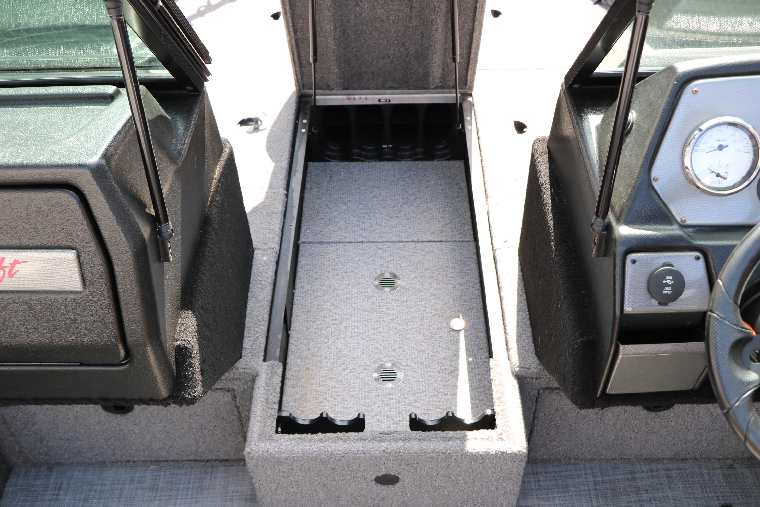 2023 Alumacraft Competitor FSX 185 boat interior with storage compartment and dashboard.