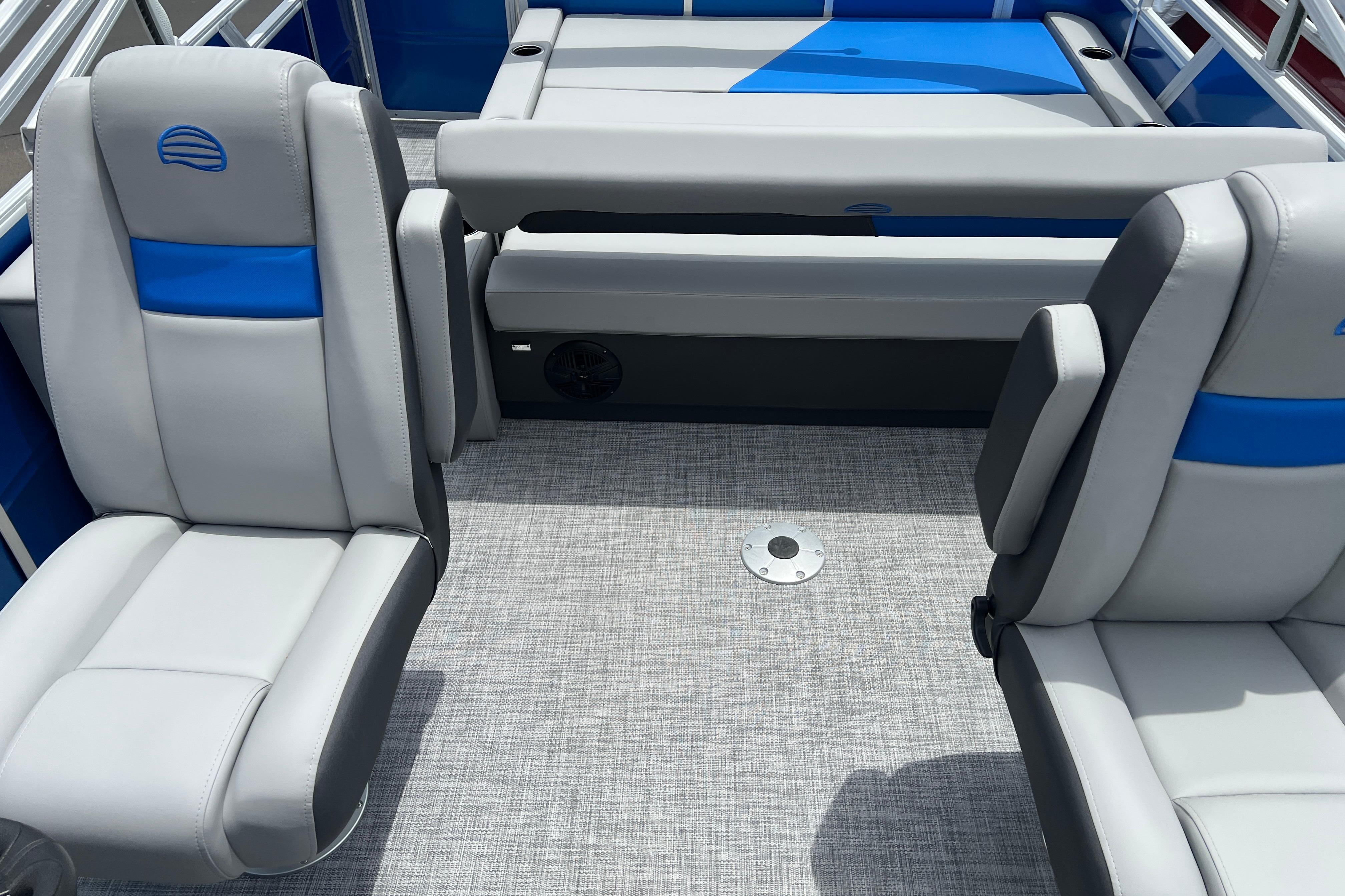 2026 Sun Tracker Party Barge 22 RF DLX interior with gray and blue seating.