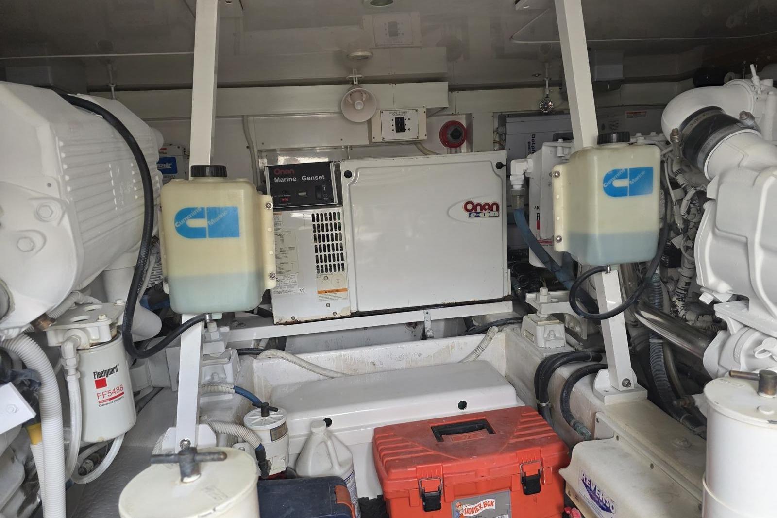 Engine room of a 2008 Post 42 boat with Onan Marine Genset.