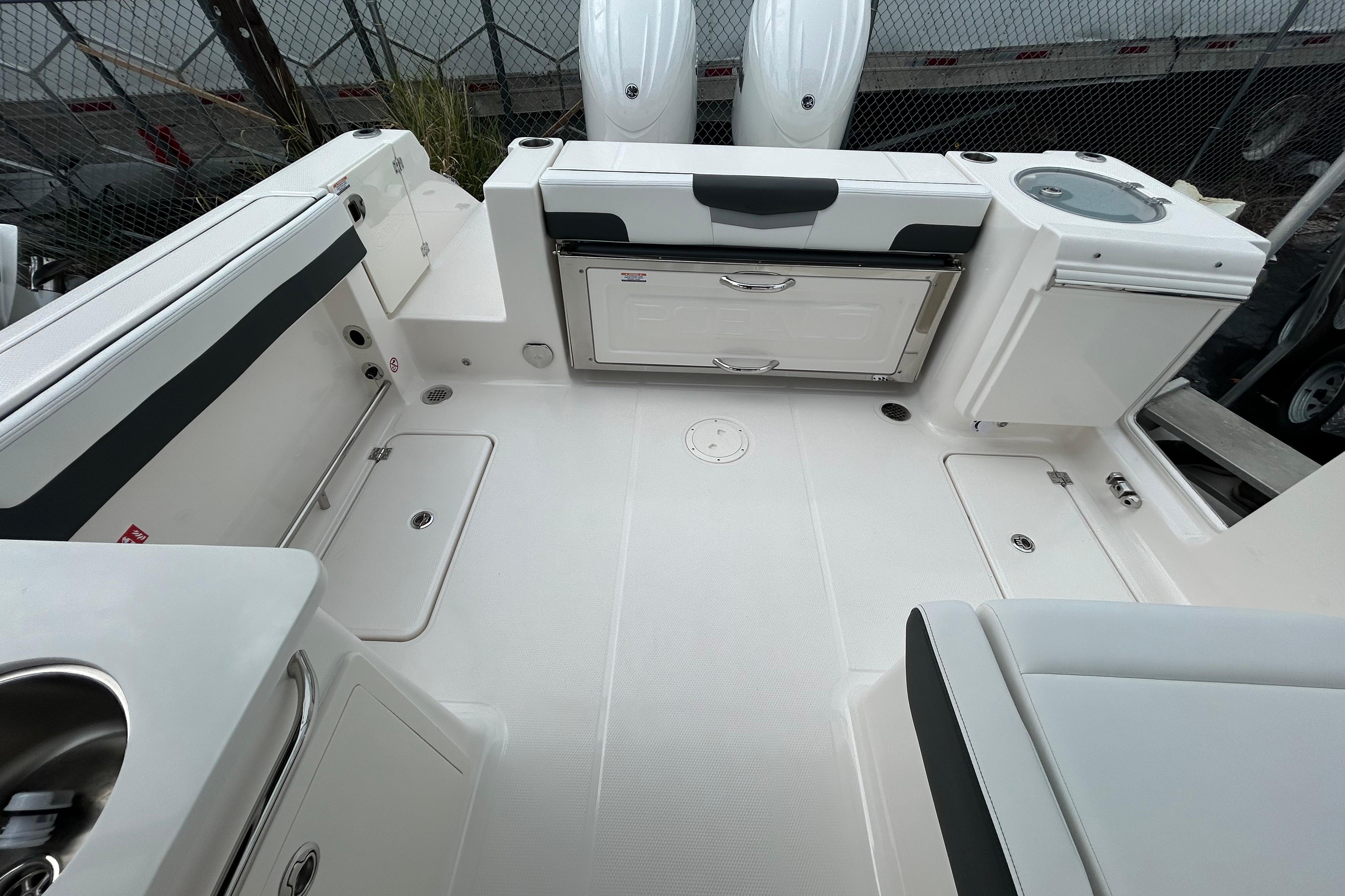 2026 Robalo R257 Dual Console boat interior with seating and storage compartments.