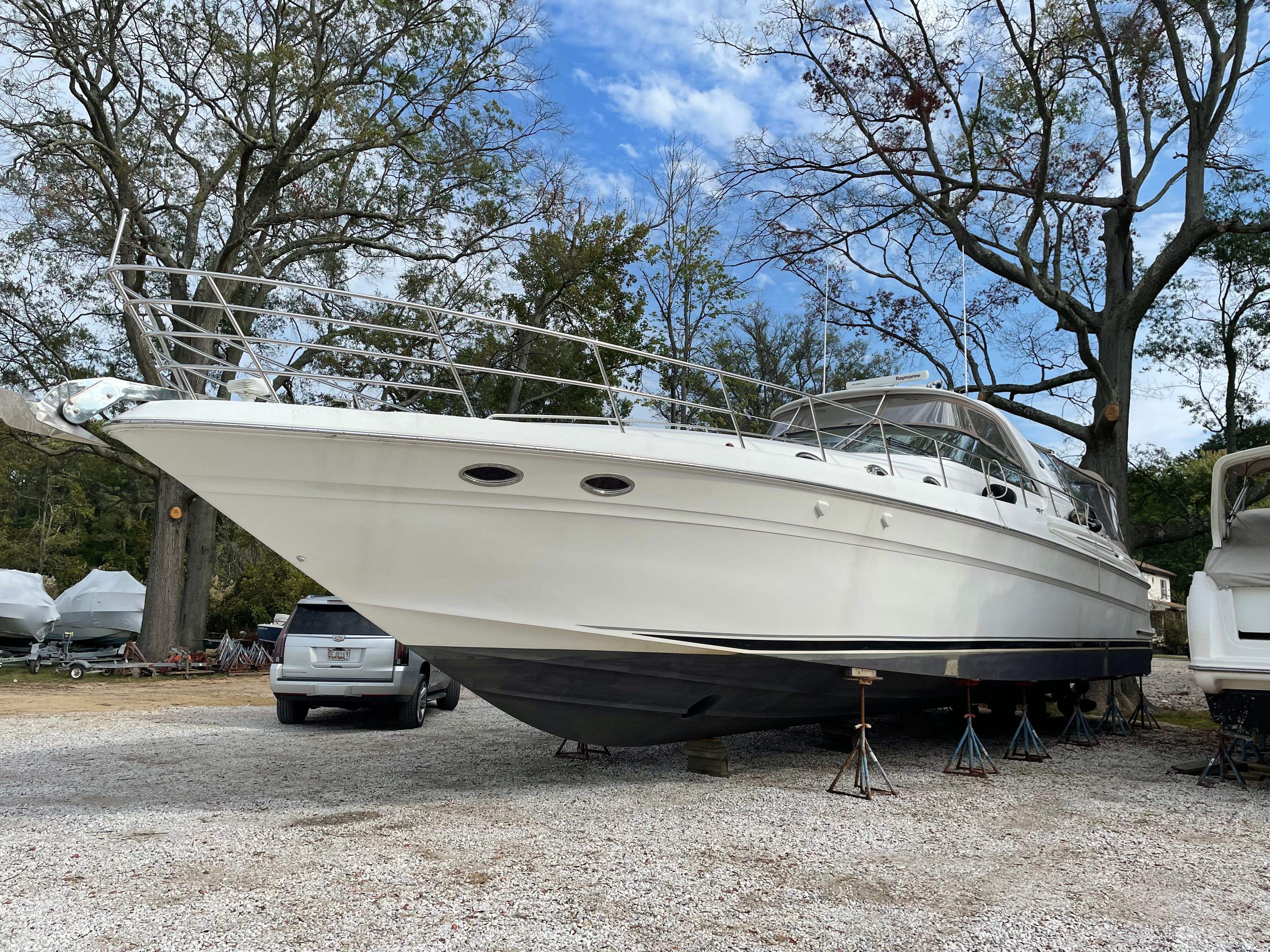 2003 Sea Ray S600 Sunsport on a boat storage lot.