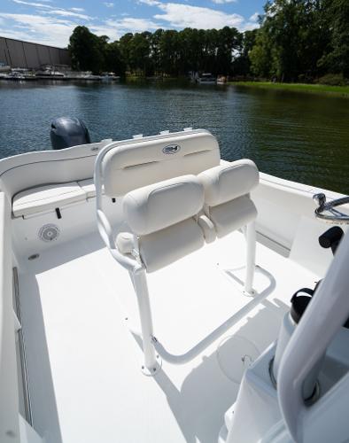 2024 Sea Hunt Ultra 234 boat interior with dual white cushioned seats.