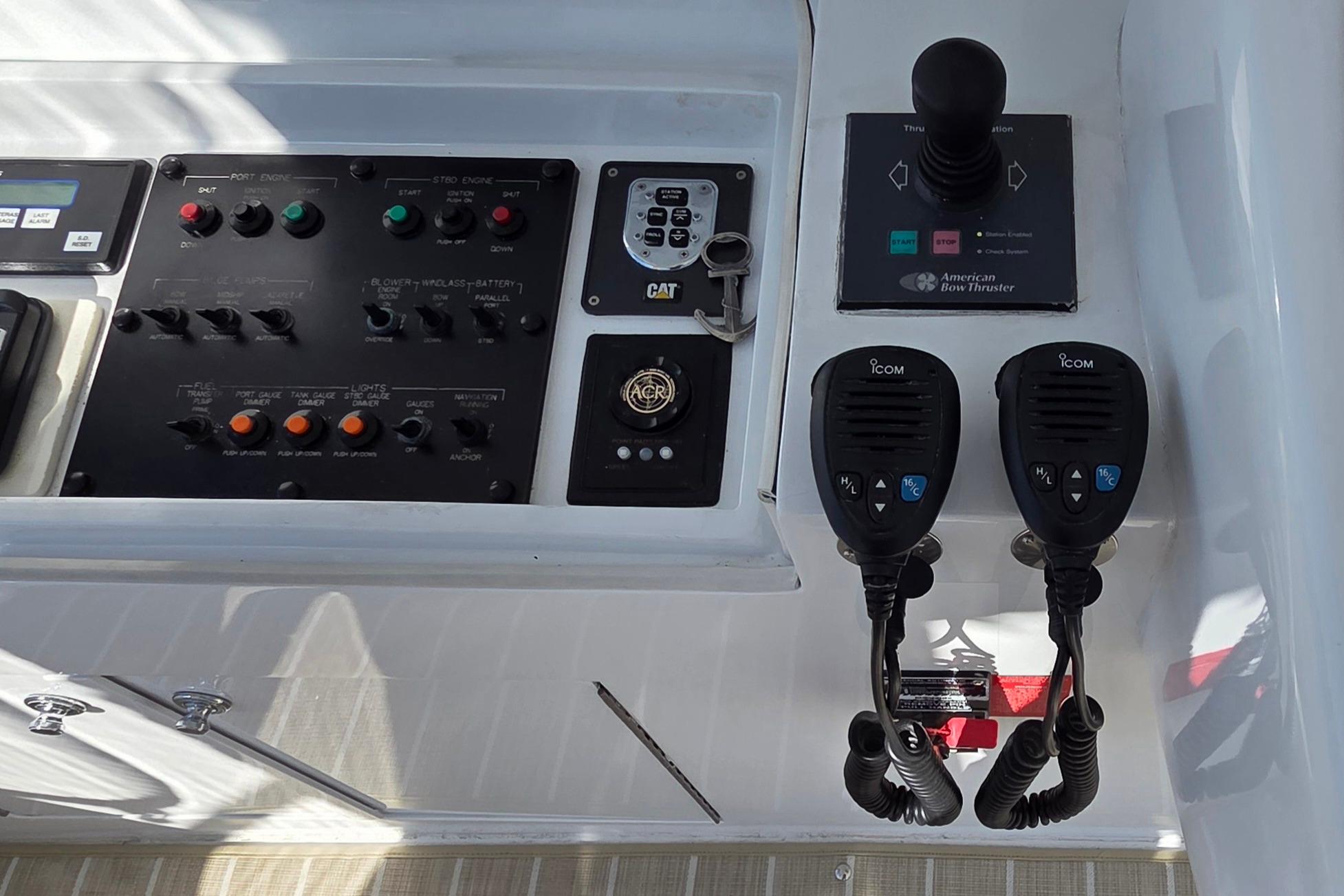 Control panel of a 2006 Hatteras 50 Convertible yacht with communication devices.