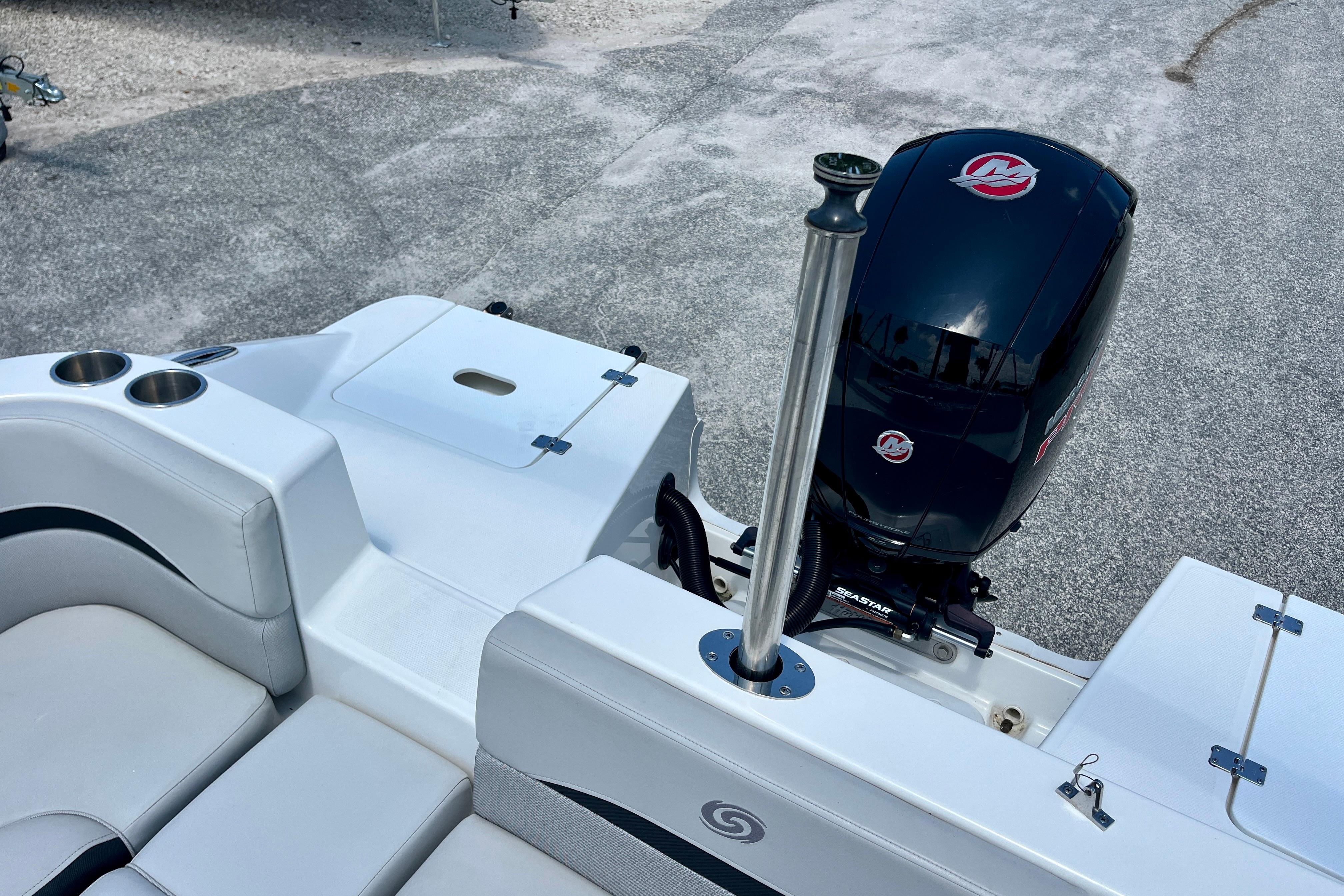 2024 Hurricane Sundeck Sport 218 OB boat with sleek seating and powerful outboard motor.