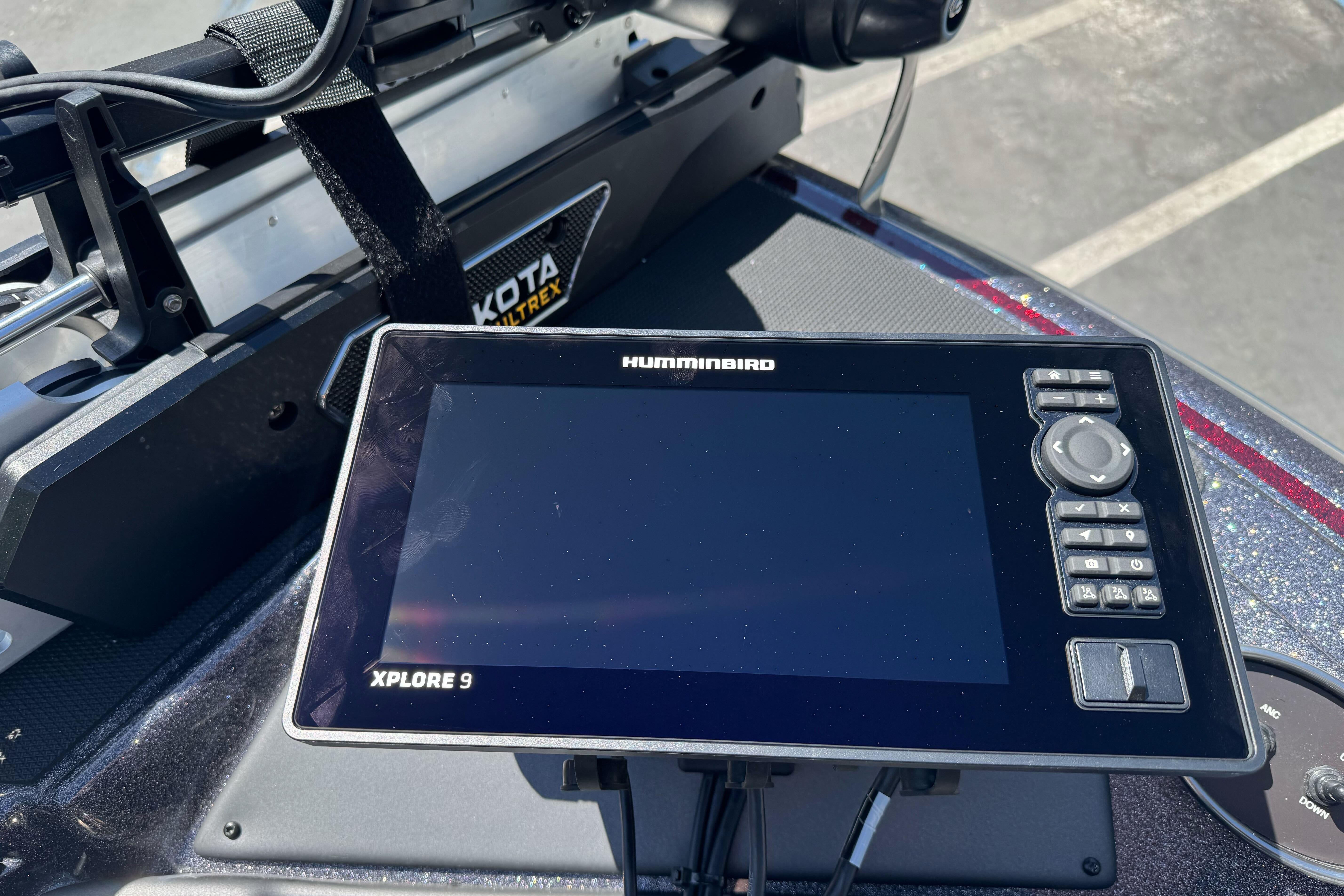 Humminbird Xplore 9 fishfinder on 2026 Triton 18 TrX boat dashboard.