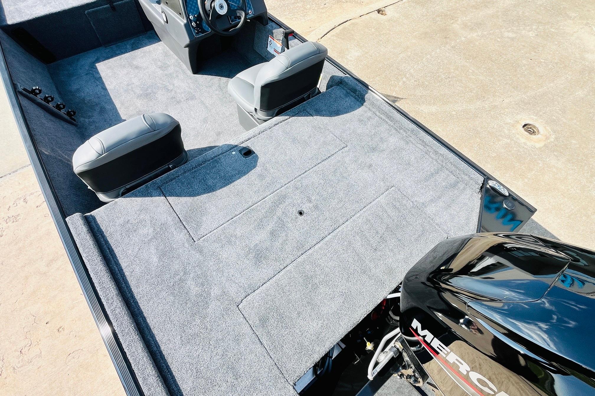 2026 Tracker Bass Tracker Classic XL boat interior with gray carpet and dual seats.