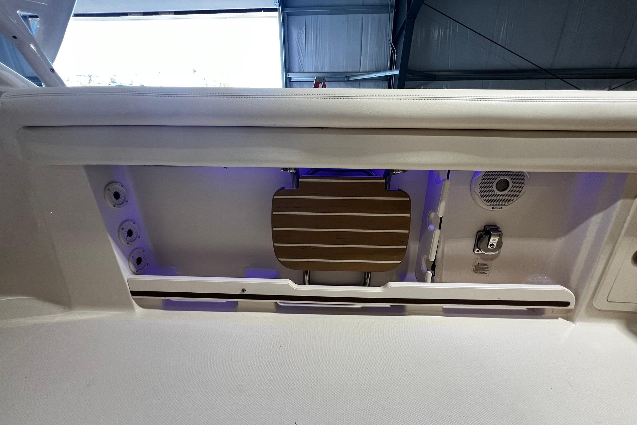 2014 Grady-White Freedom 275 boat interior with seating and storage features.