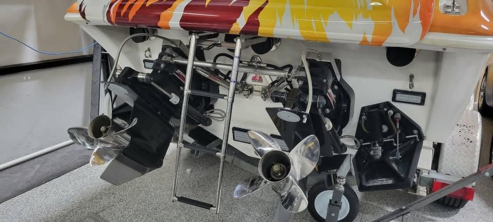 Rear view of a 2003 Sunsation 32 Dominator boat with propellers.