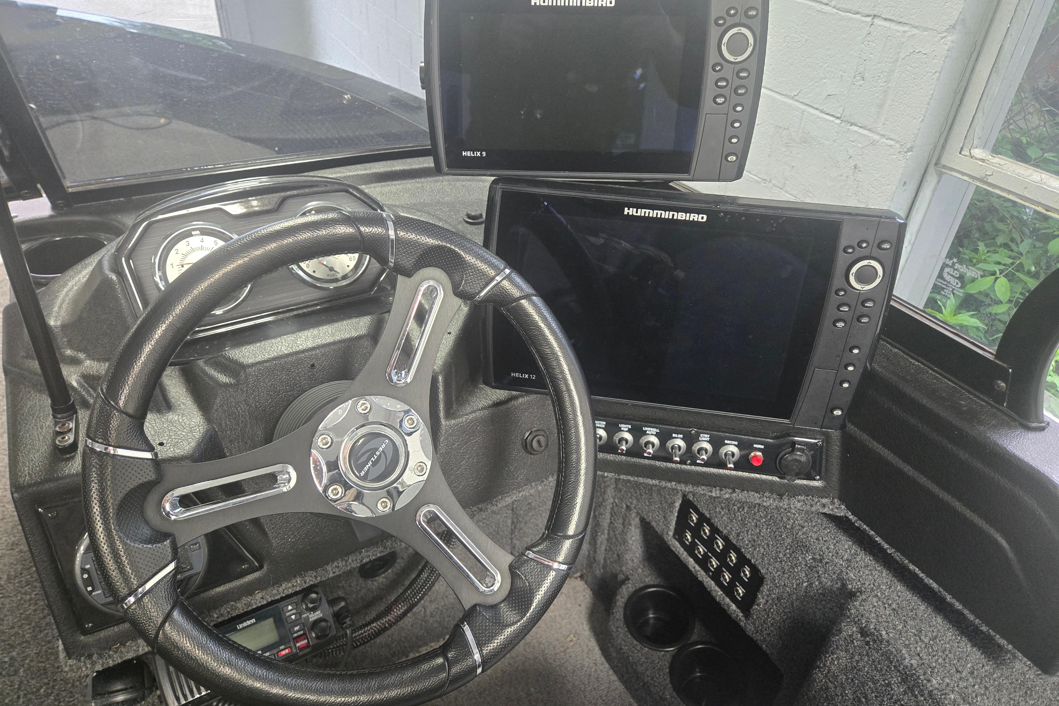 2020 Crestliner 1850 Raptor WT dashboard with steering wheel and Humminbird electronics.