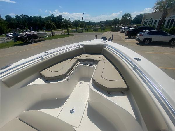 2024 Key West 239 FS boat with spacious bow seating in a parking lot.