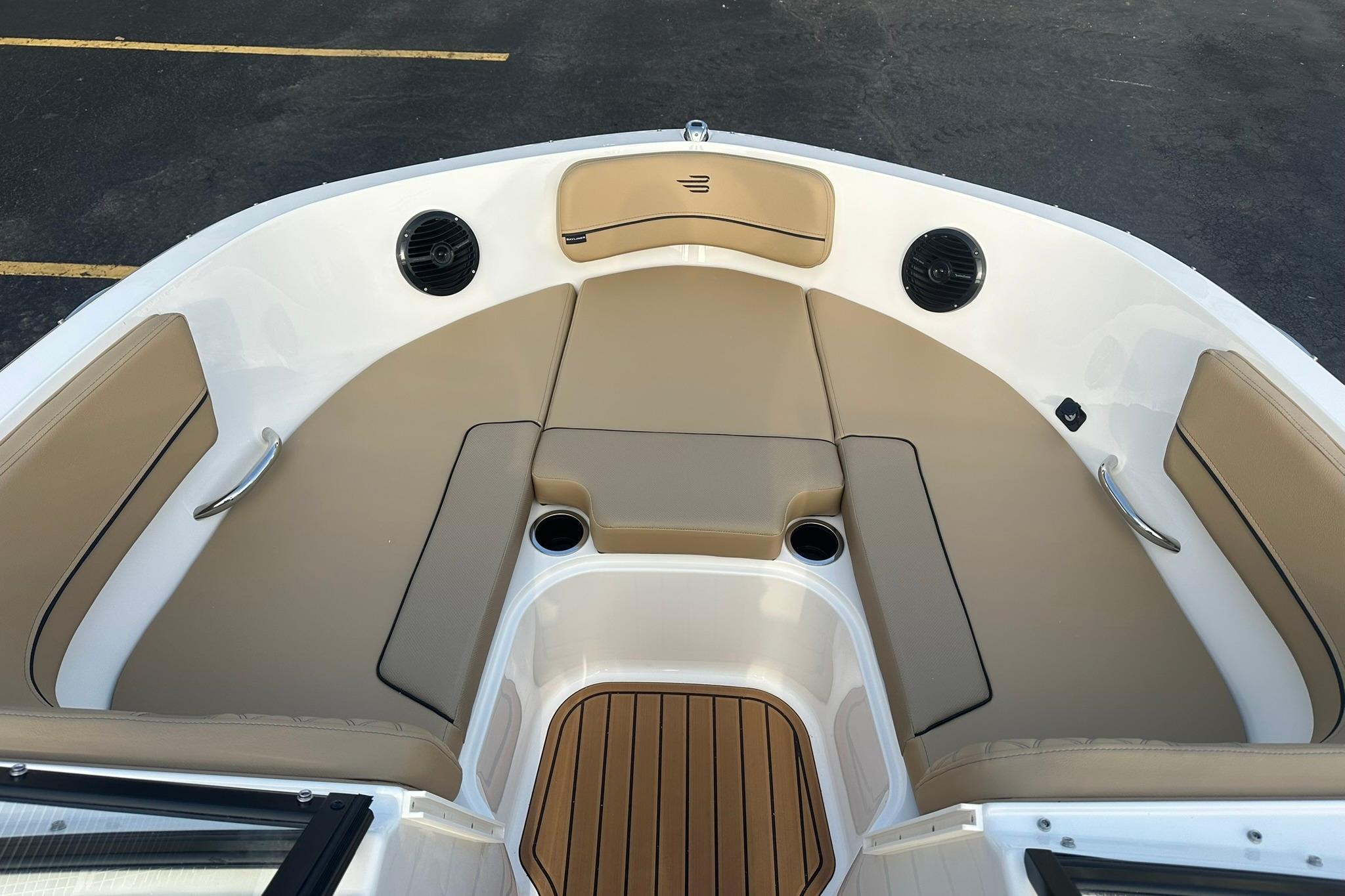2026 Bayliner VR6 Bowrider OB interior with tan seating and cup holders.