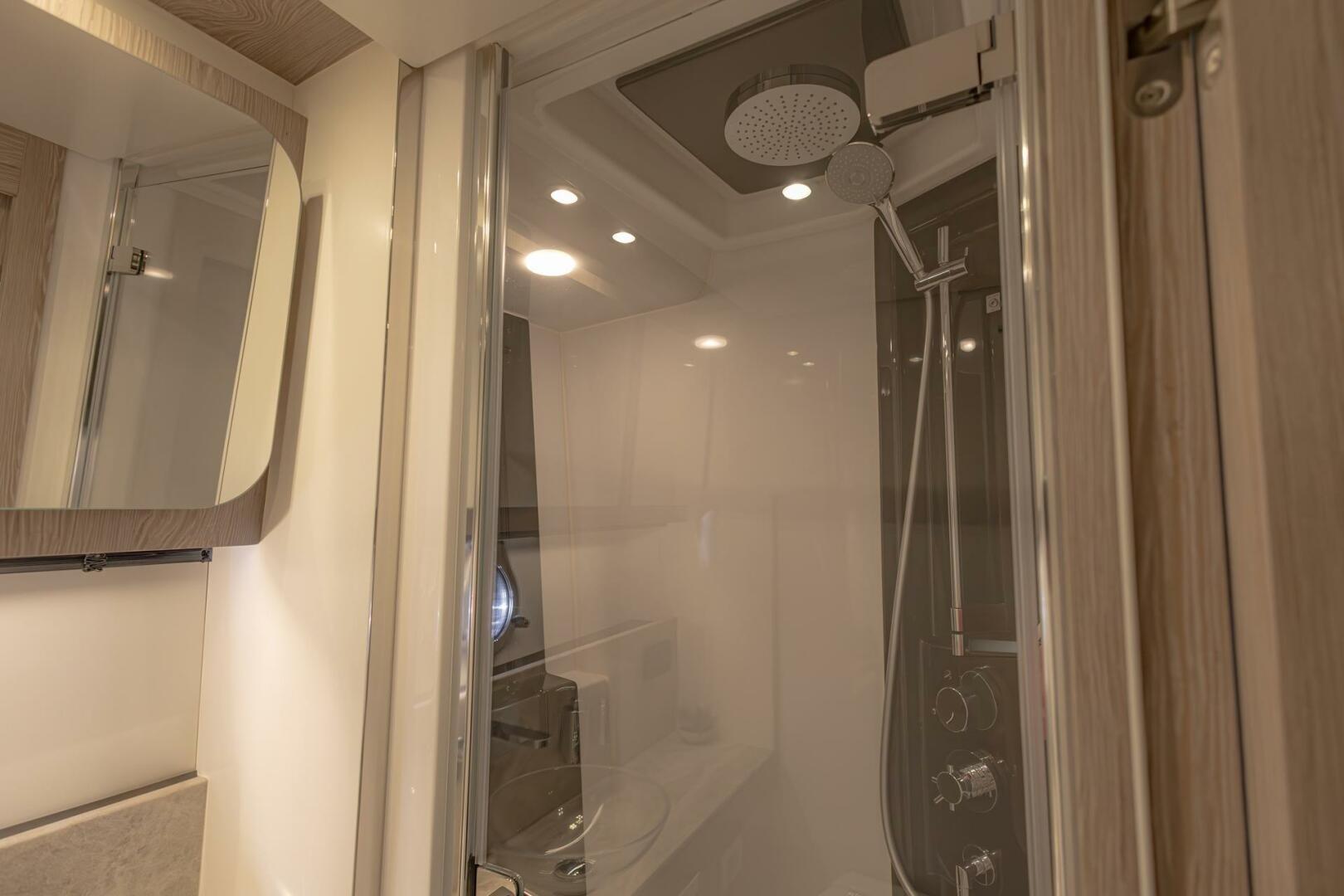 Luxurious bathroom interior of 2023 Azimut S6 Sport-Fly yacht with modern shower design.