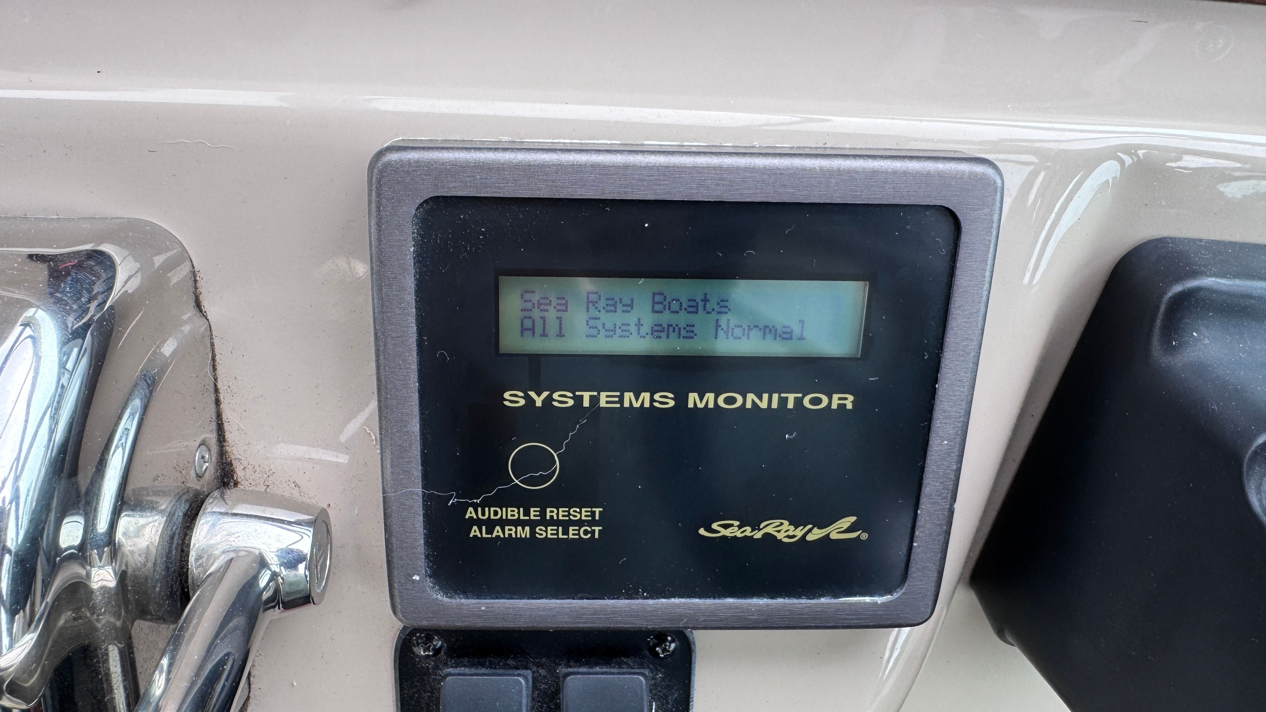 A systems monitor on a Sea Ray 360 Sundancer boat displays "All Systems Normal."